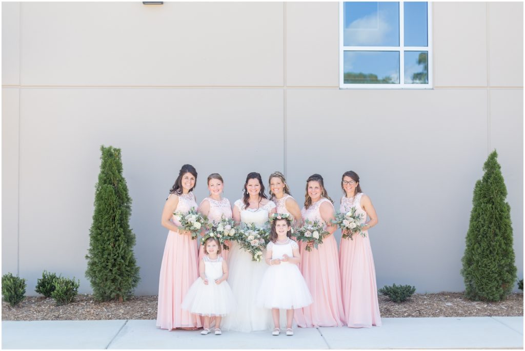 bride + bridesmaids with flower girls