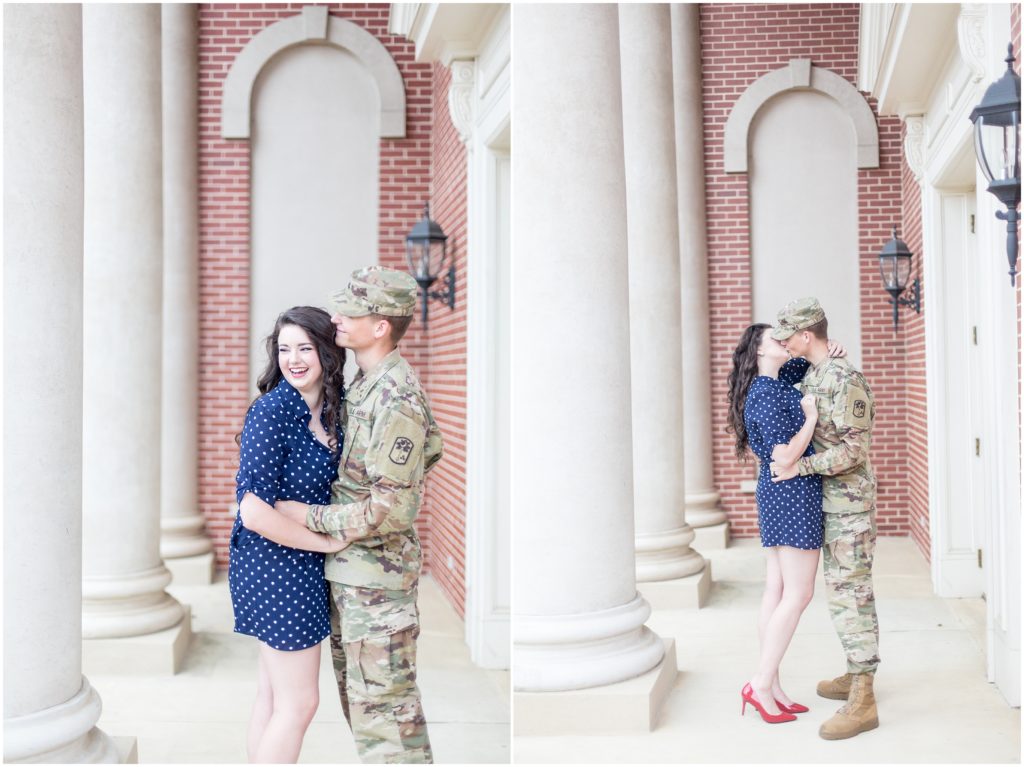 woman in blue and white polk-a-dot dress and man in his army uniform pose for engagement photos