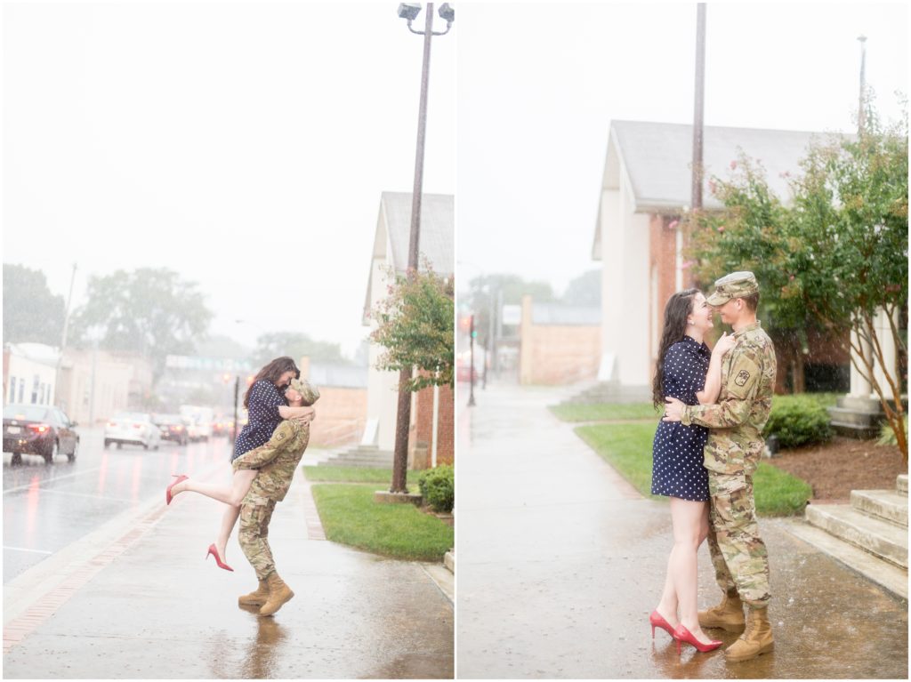 couple kisses in the rain during Lawrenceville GA Military Engagement