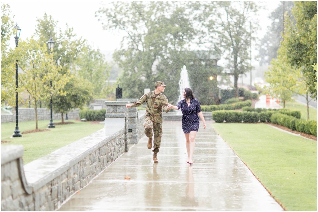 couple runs in the rain during military engagement in Lawrenceville GA 