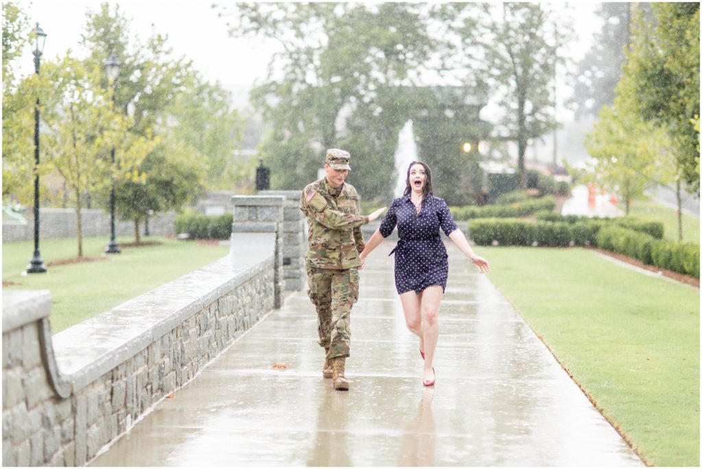 couple walks in the rain during military engagement in Lawrenceville GA 
