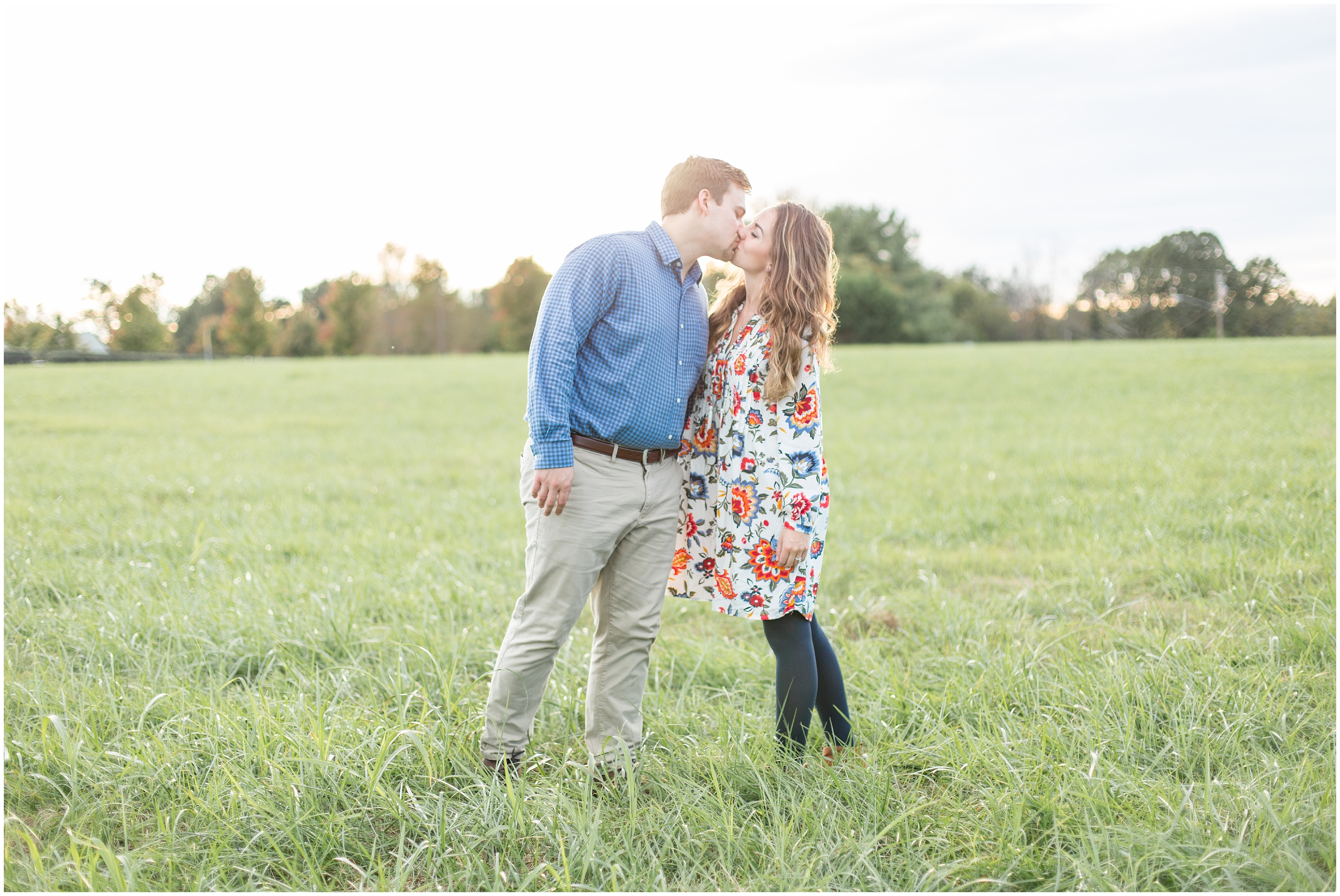 couple share a kiss for  covered Bridge engagement session