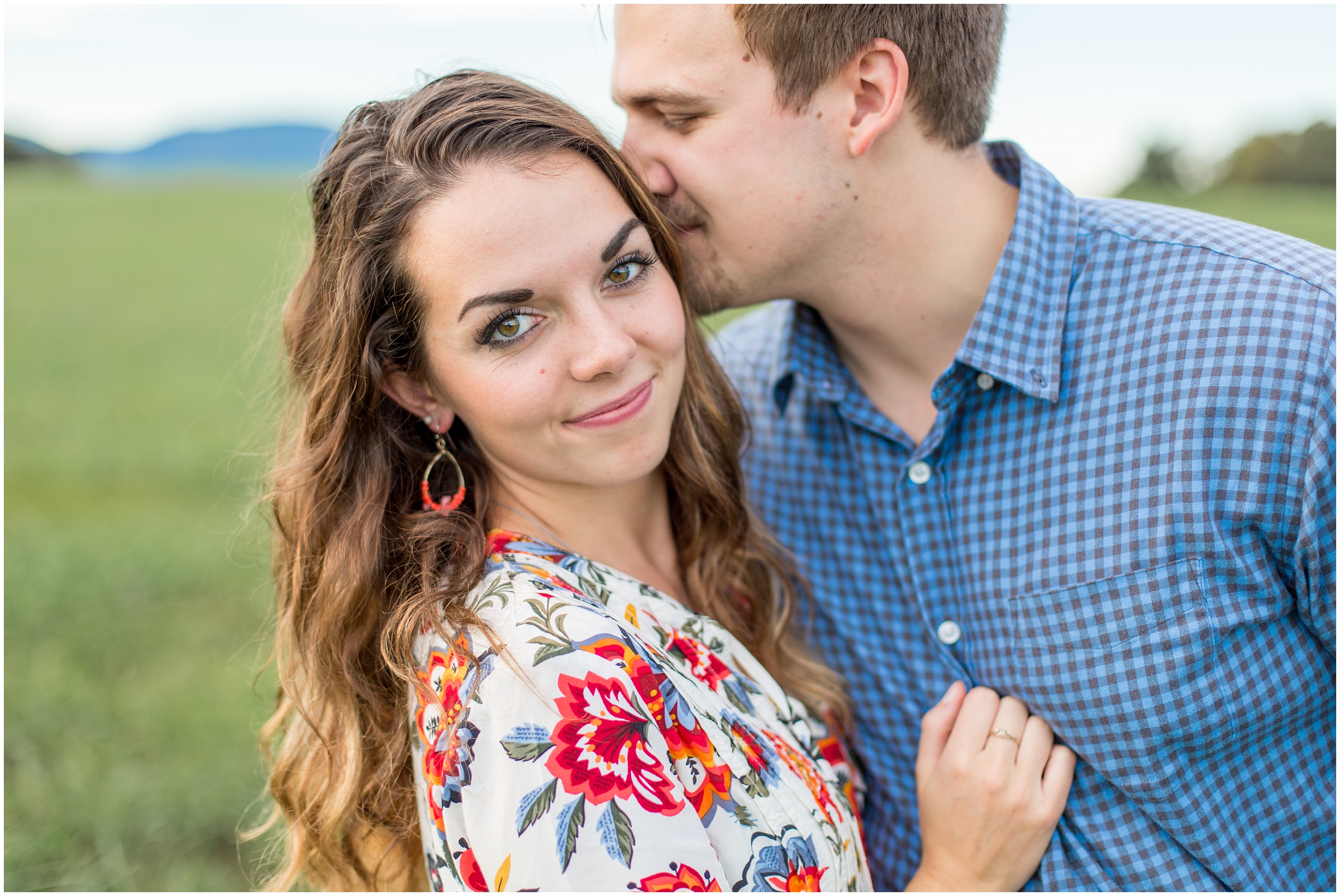 man kisses fiance during engagement photos