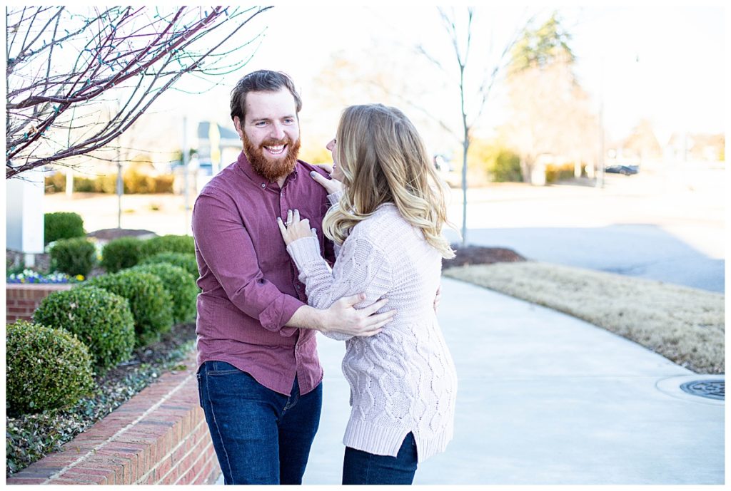 couple in shades of pink of purple during engagement session in Greenville SC