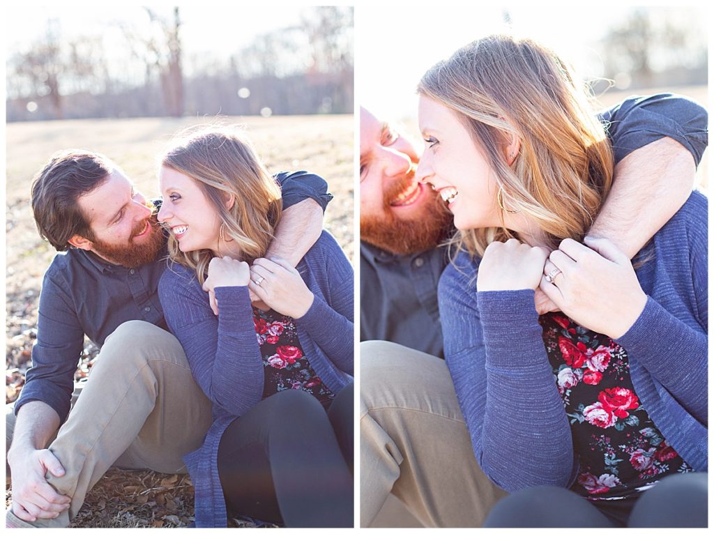 couple sits on ground during outdoor engagement session in SC 