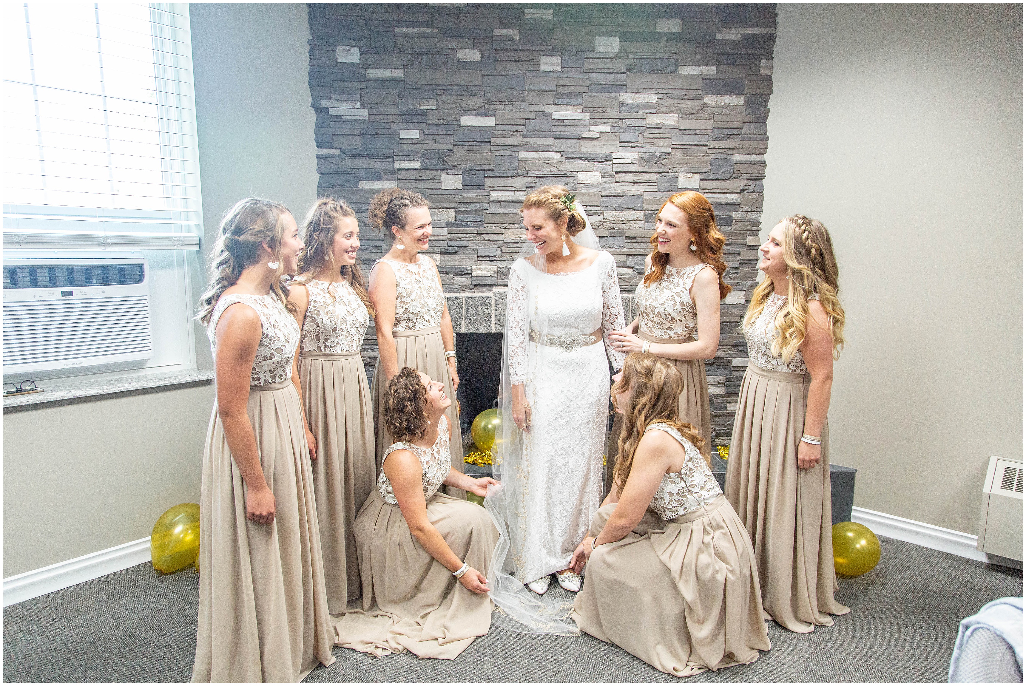 Bridesmaids help bride get ready for Classy Detroit MI Wedding 