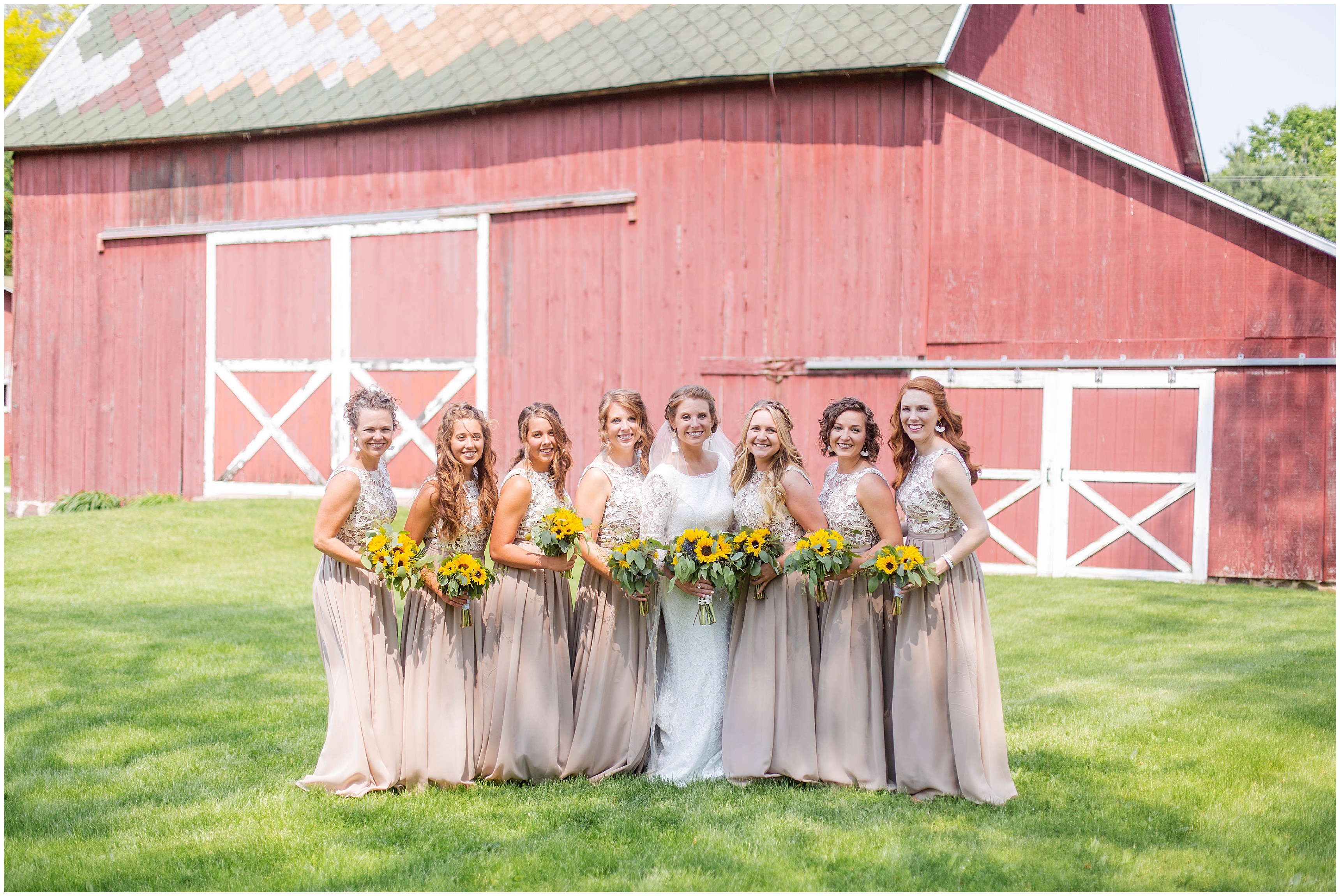 bride with her bridesmaids holding sunflower bouquets during Classy MI wedding