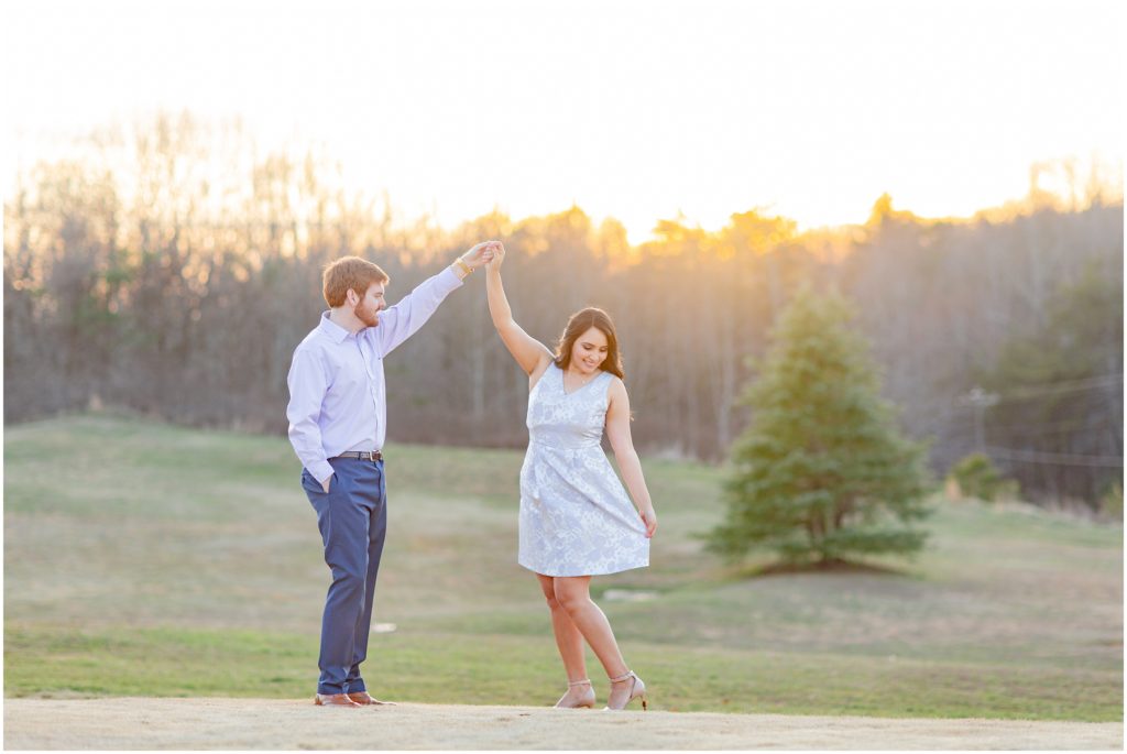 man twirls fiance in SC engagement session 