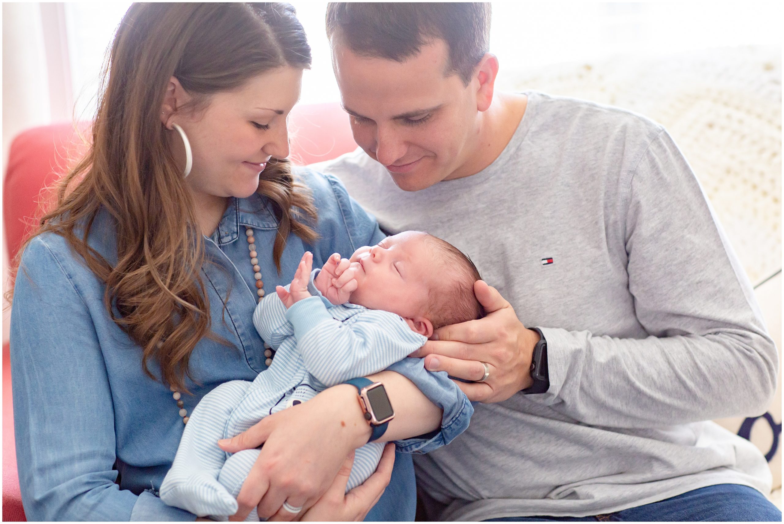 parents with son during Georgia newborn lifestyle session featuring baby boy