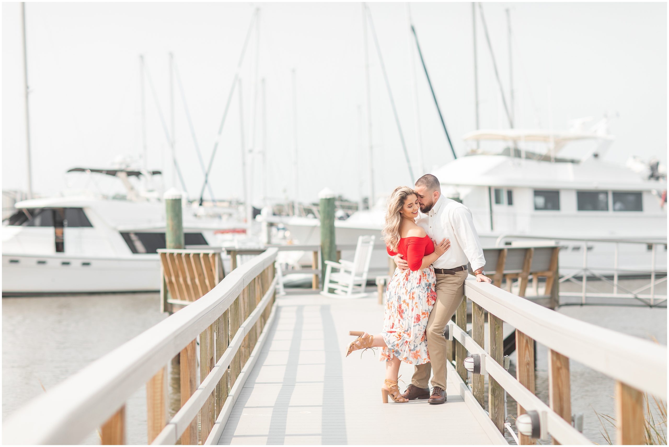 couple walks down marina in Charleston SC
