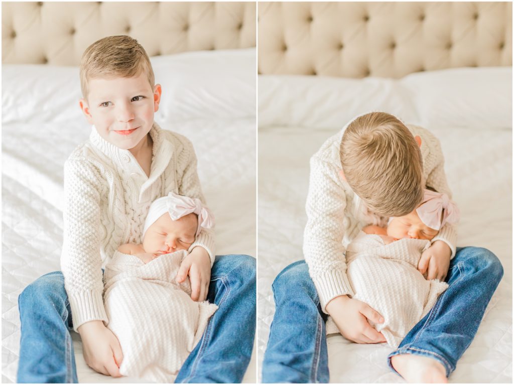 big brother holds baby sister during newborn photos at home 
