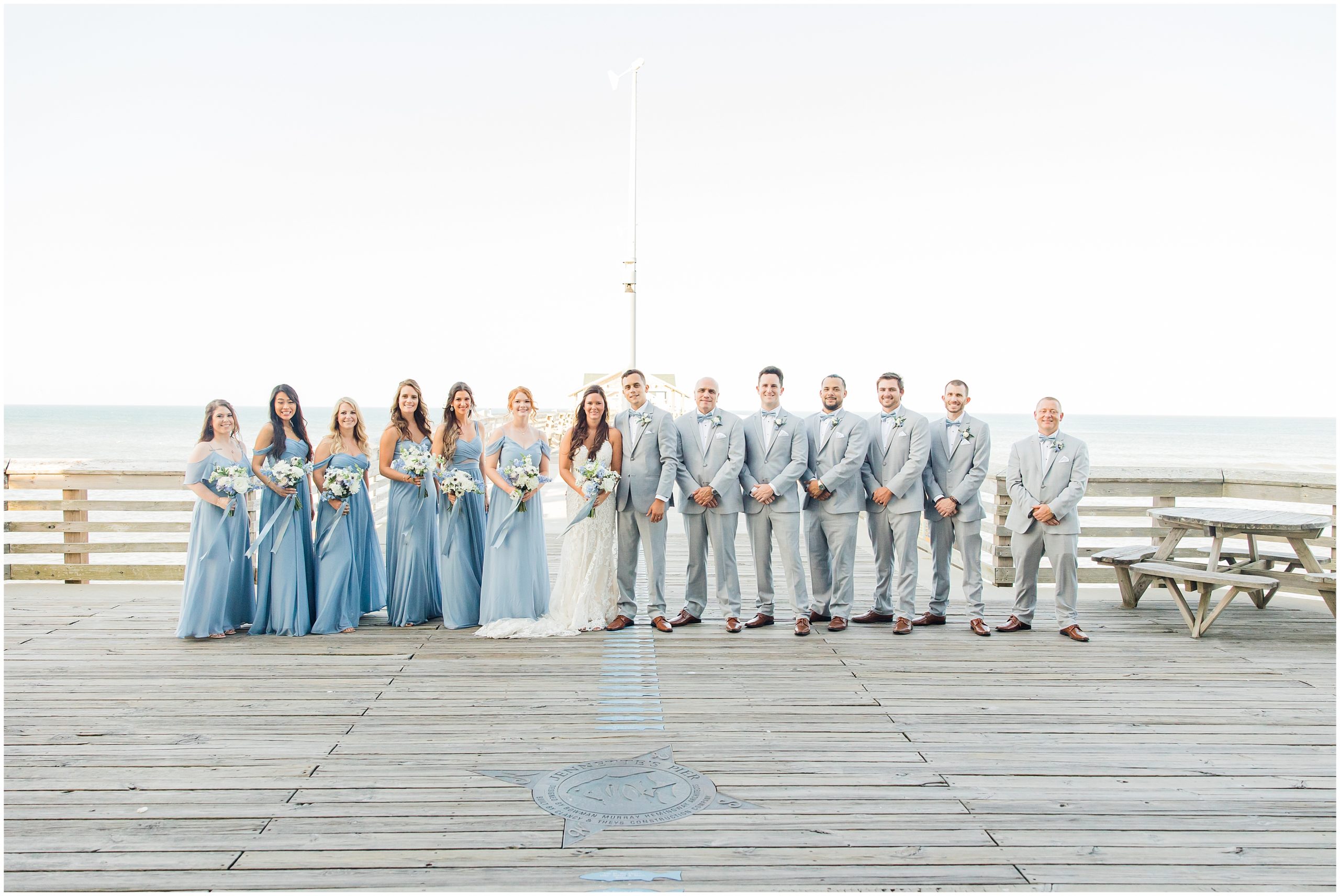 newlyweds pose with wedding party in Nags Head NC
