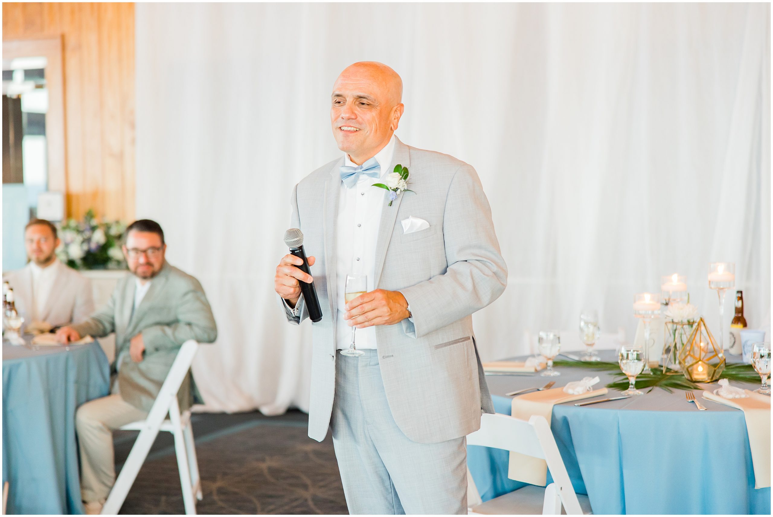 dad welcomes guests to wedding reception at Jennette's Pier