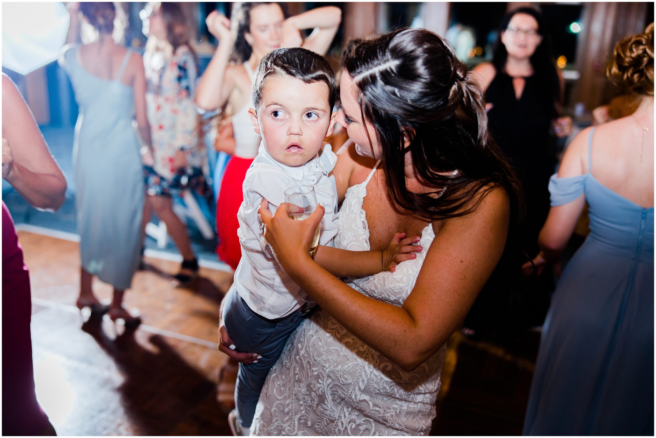 bride dances with son during Jennette's Pier Wedding reception 