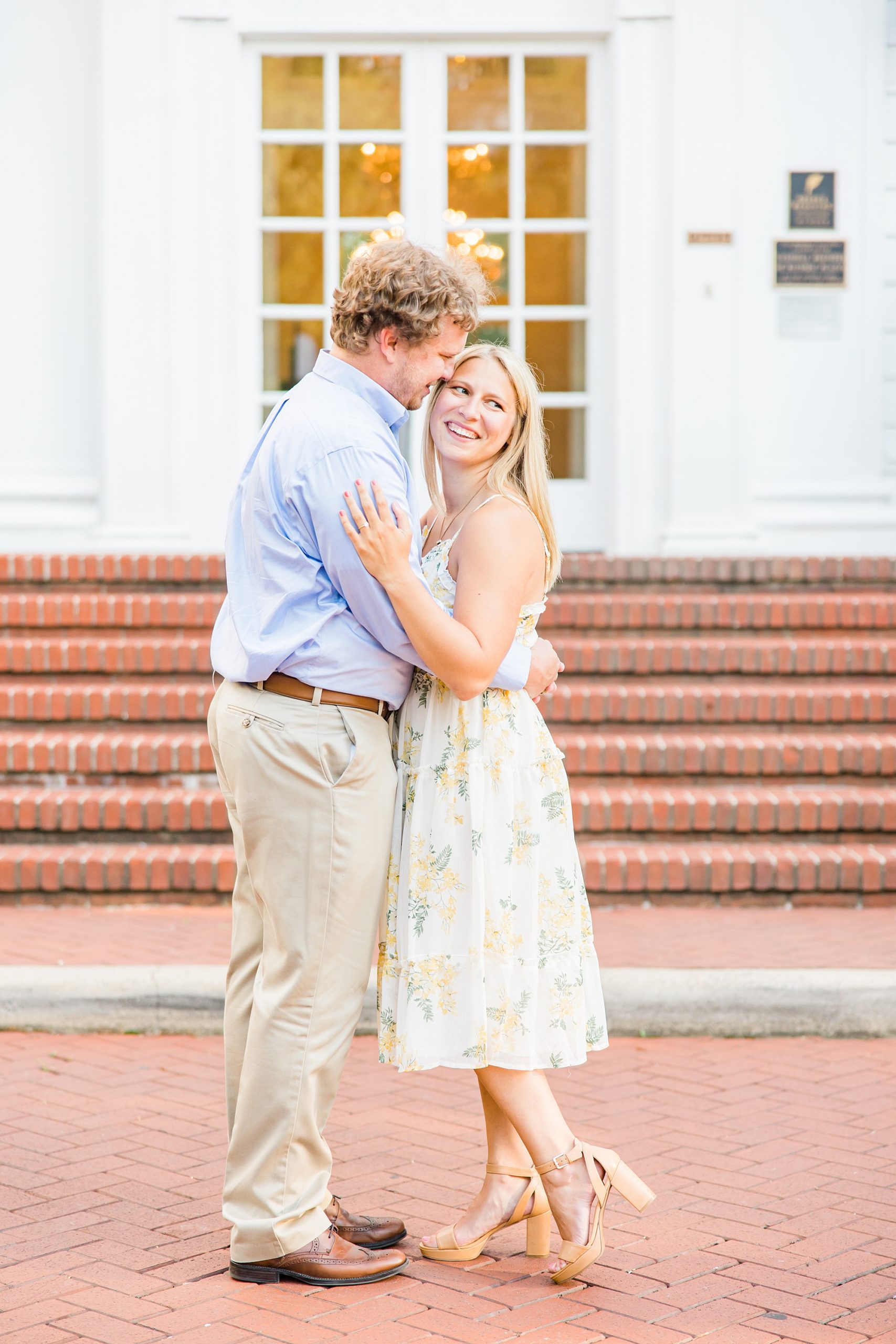 groom kisses bride's forehead during NC engagement session