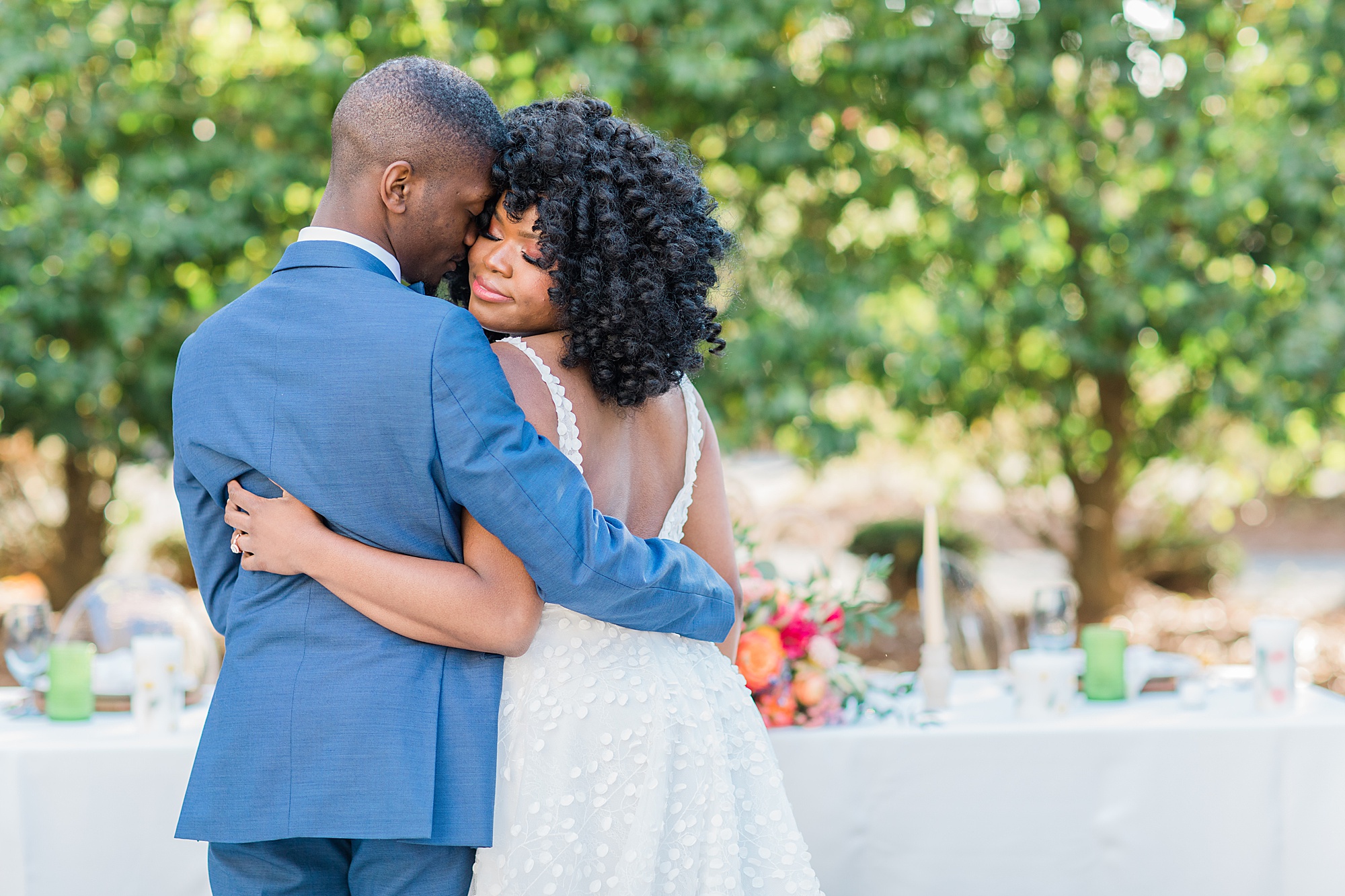 groom hugs bride to his side during Whitehead Manor wedding reception