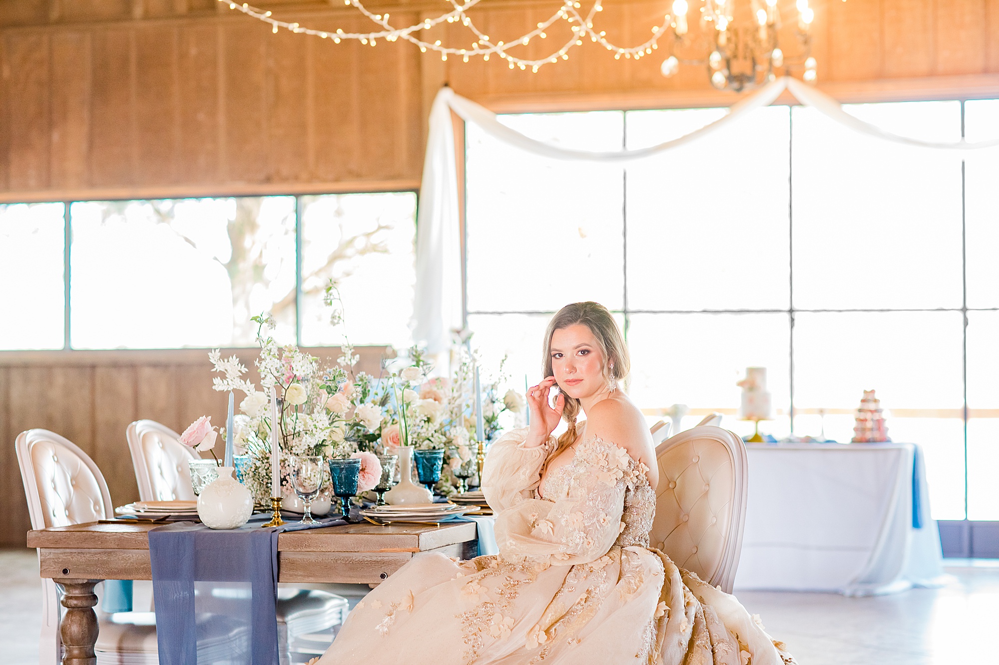 bride sits at reception during Carolina Country Weddings styled shoot
