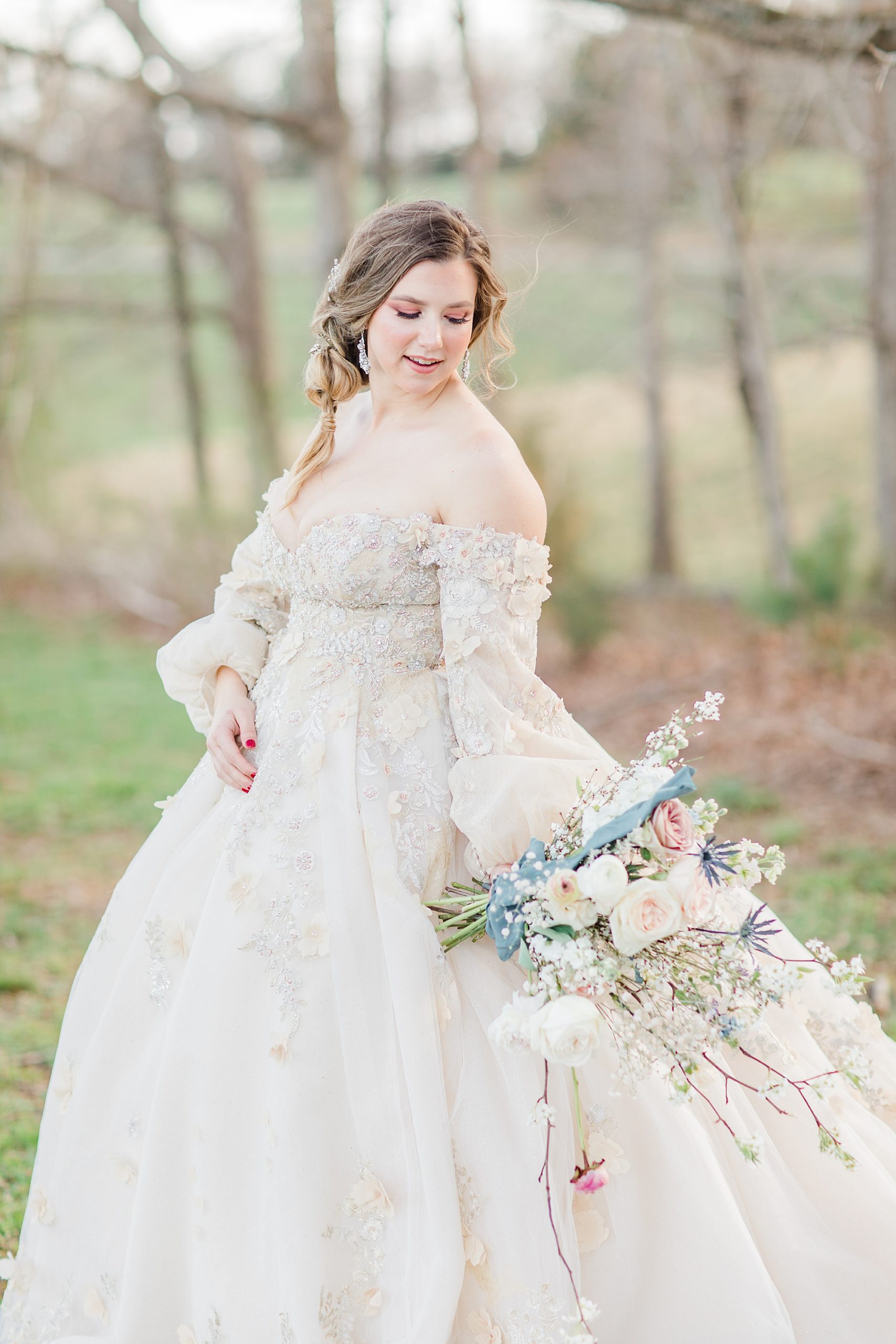 bride holds bouquet behind her looking over shoulder
