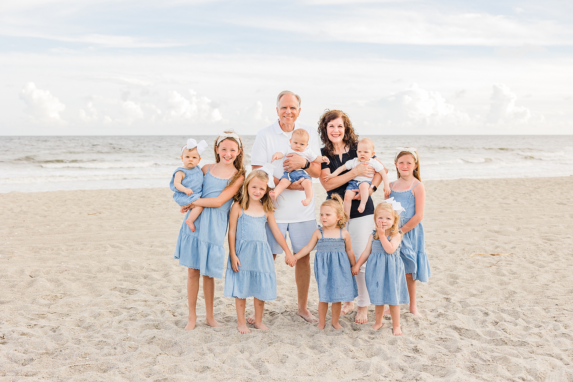 grandparents pose with grandchildren during Holden Beach family photos