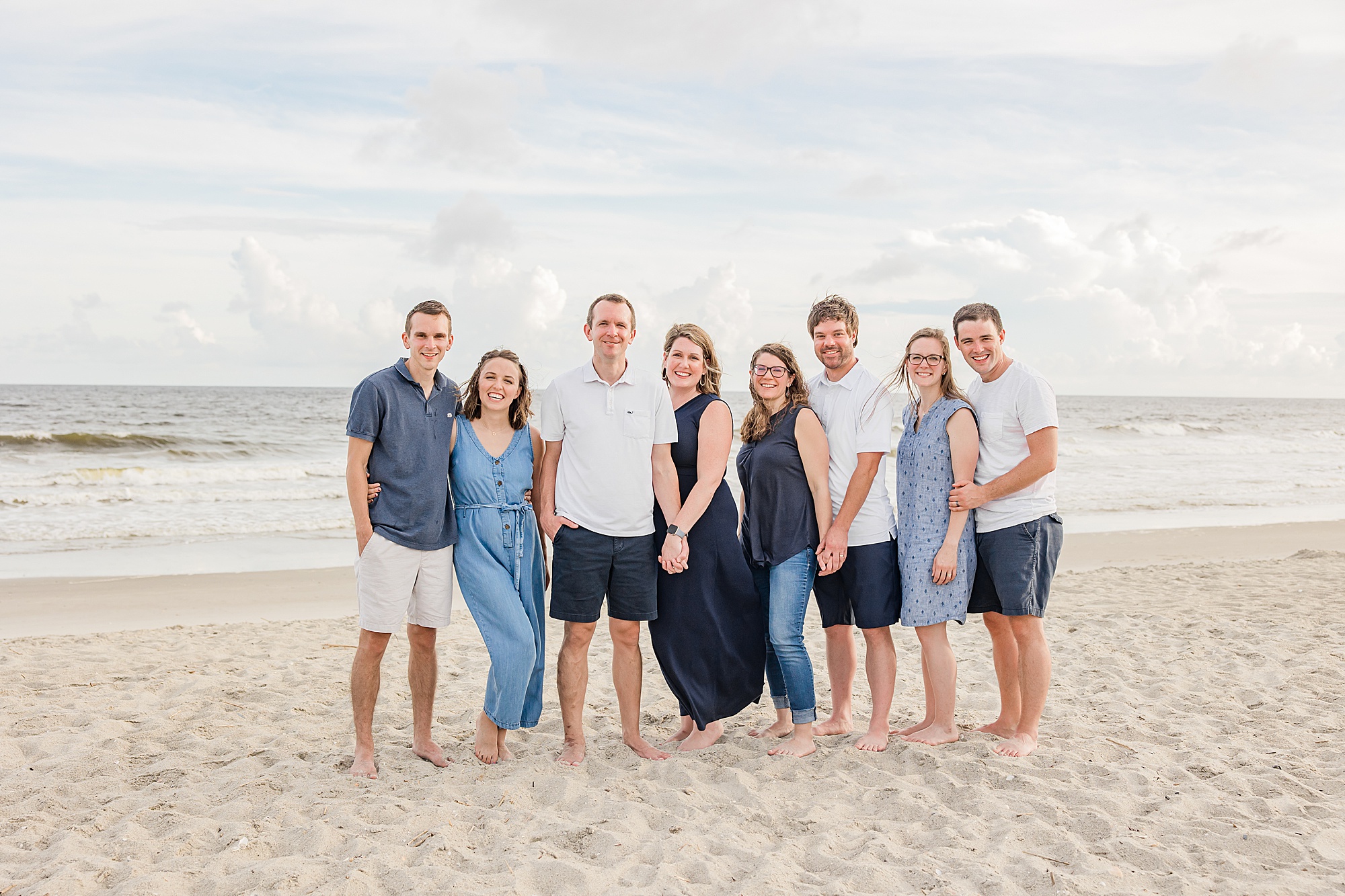 siblings stand together during Holden Beach family photos