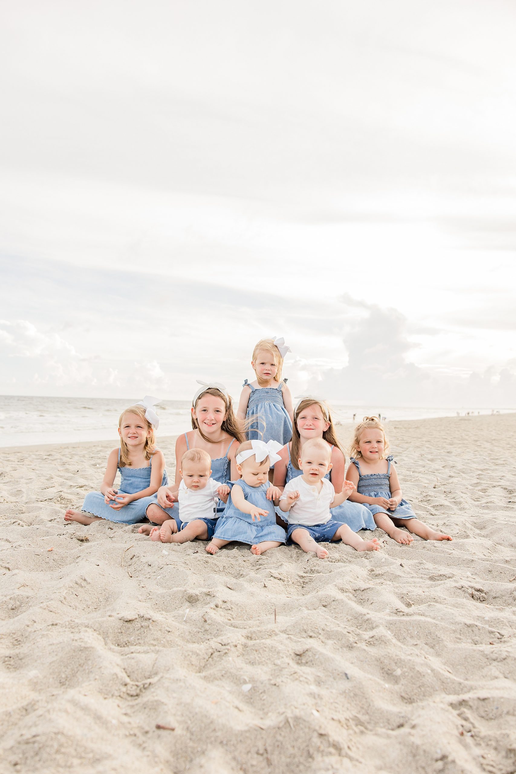 cousins sit together during Holden Beach family photos