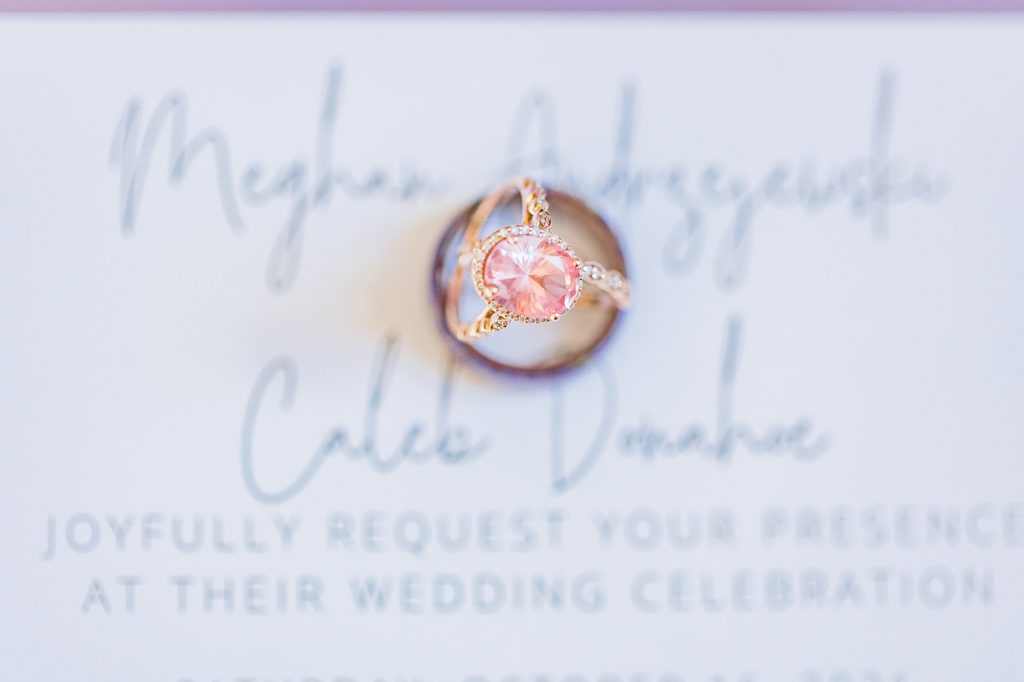 custom pink engagement ring rests on invitation for Biltmore Estate wedding