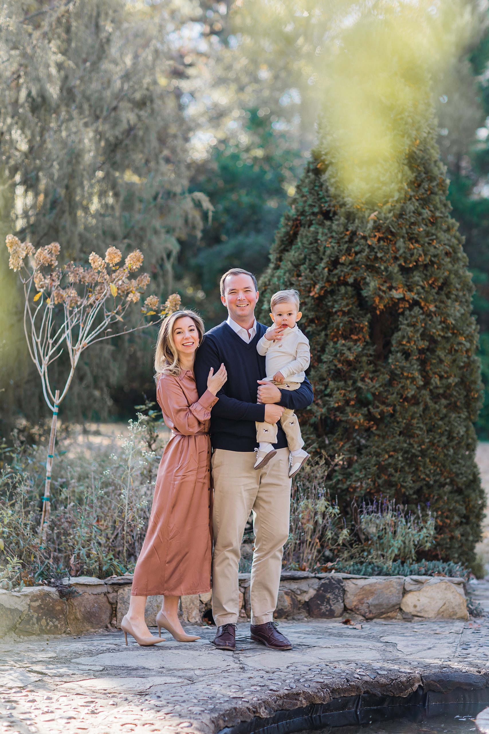 family of three poses together during  Lancaster SC family session