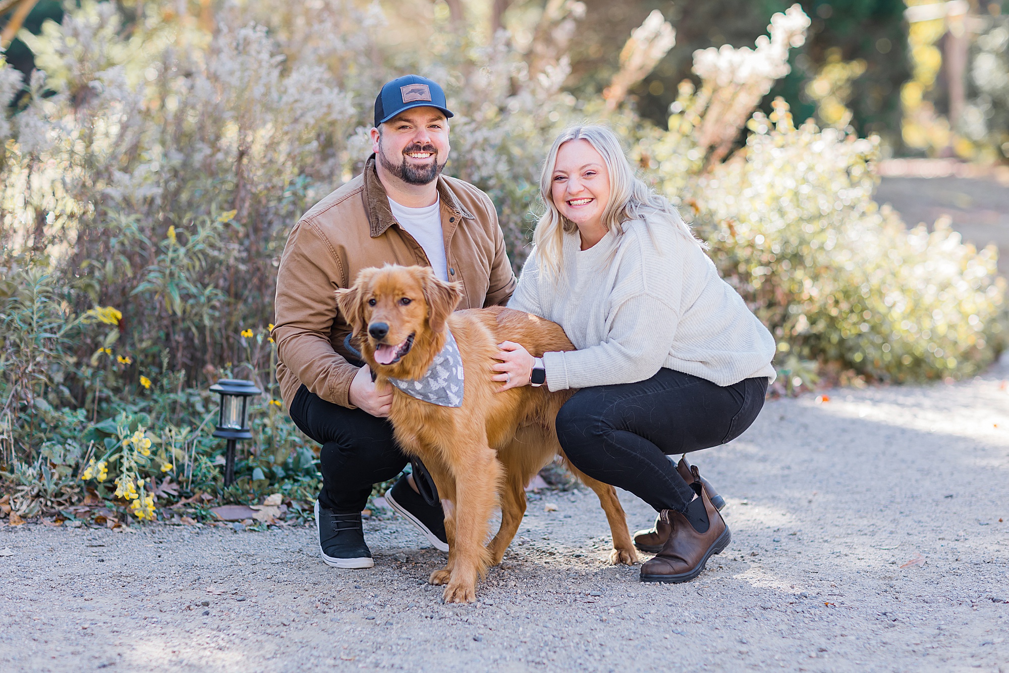 couple poses with dog during Lancaster SC family session