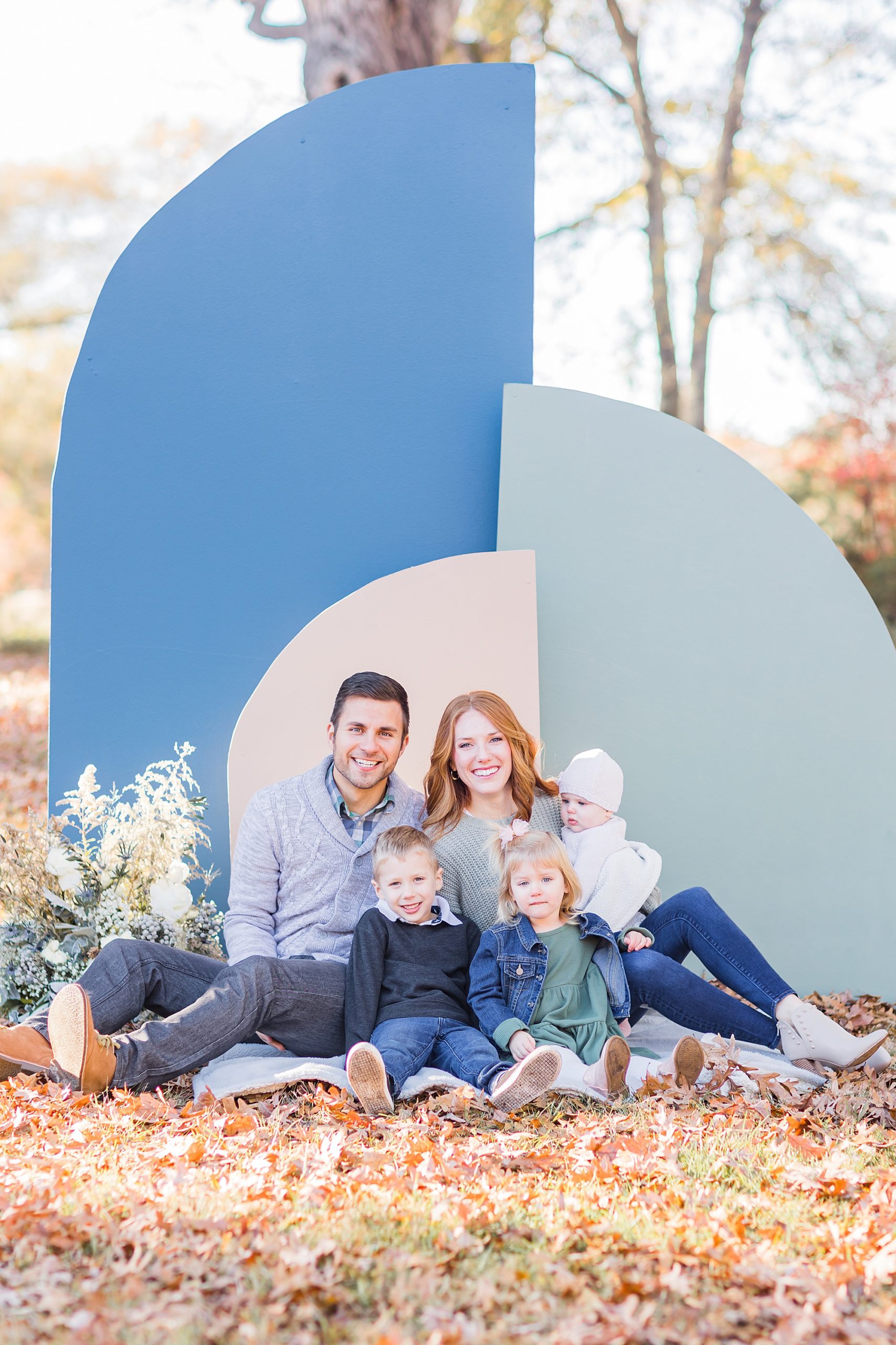  Lancaster SC family session for parents and three children by blue backdrop