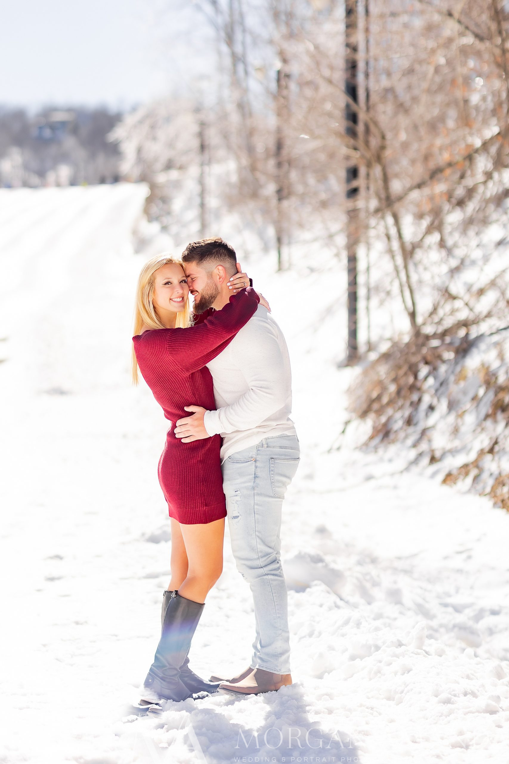 groom nuzzles bride's cheek during Beech Mountain engagement session