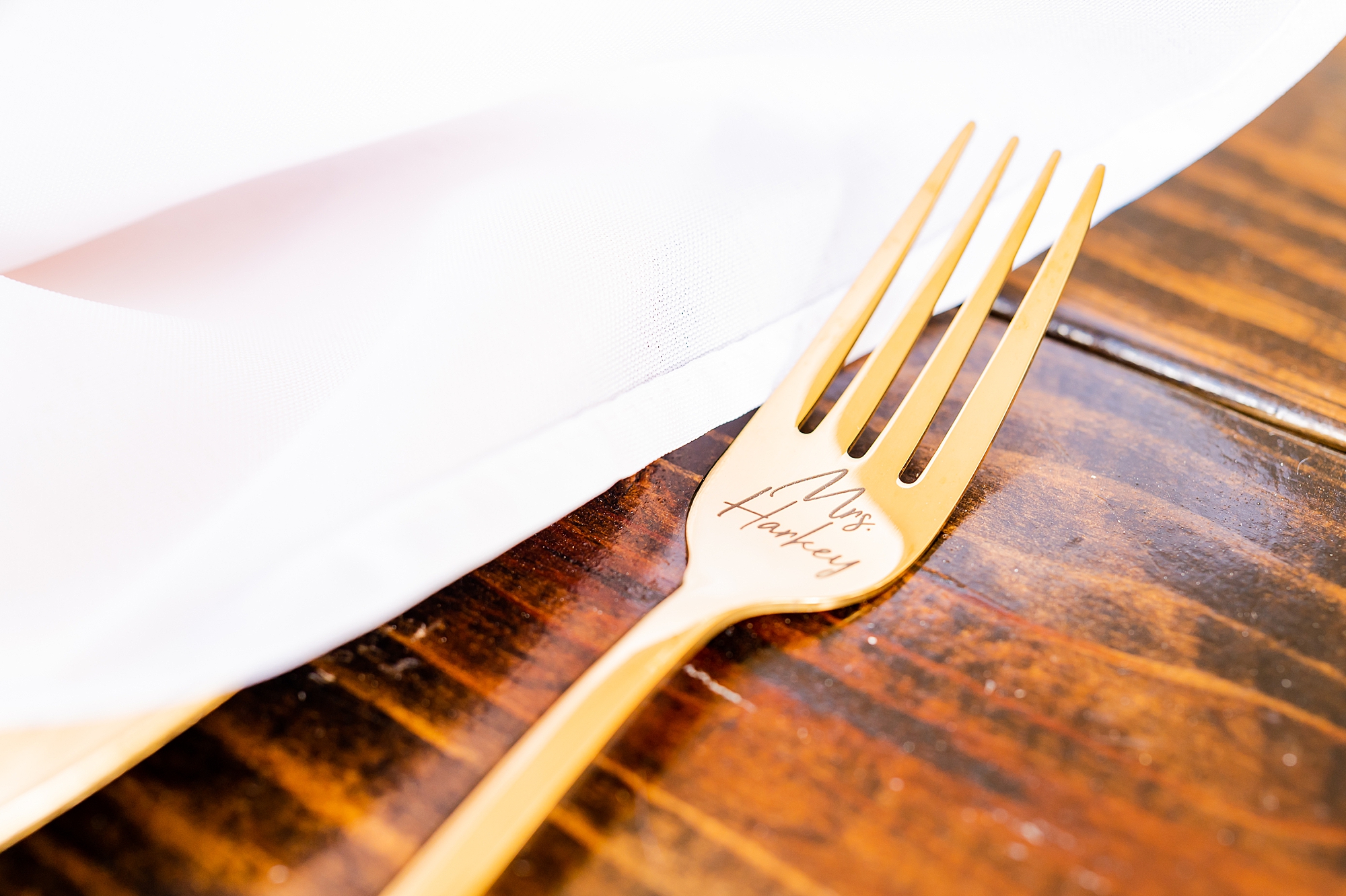 gold fork on wooden table 