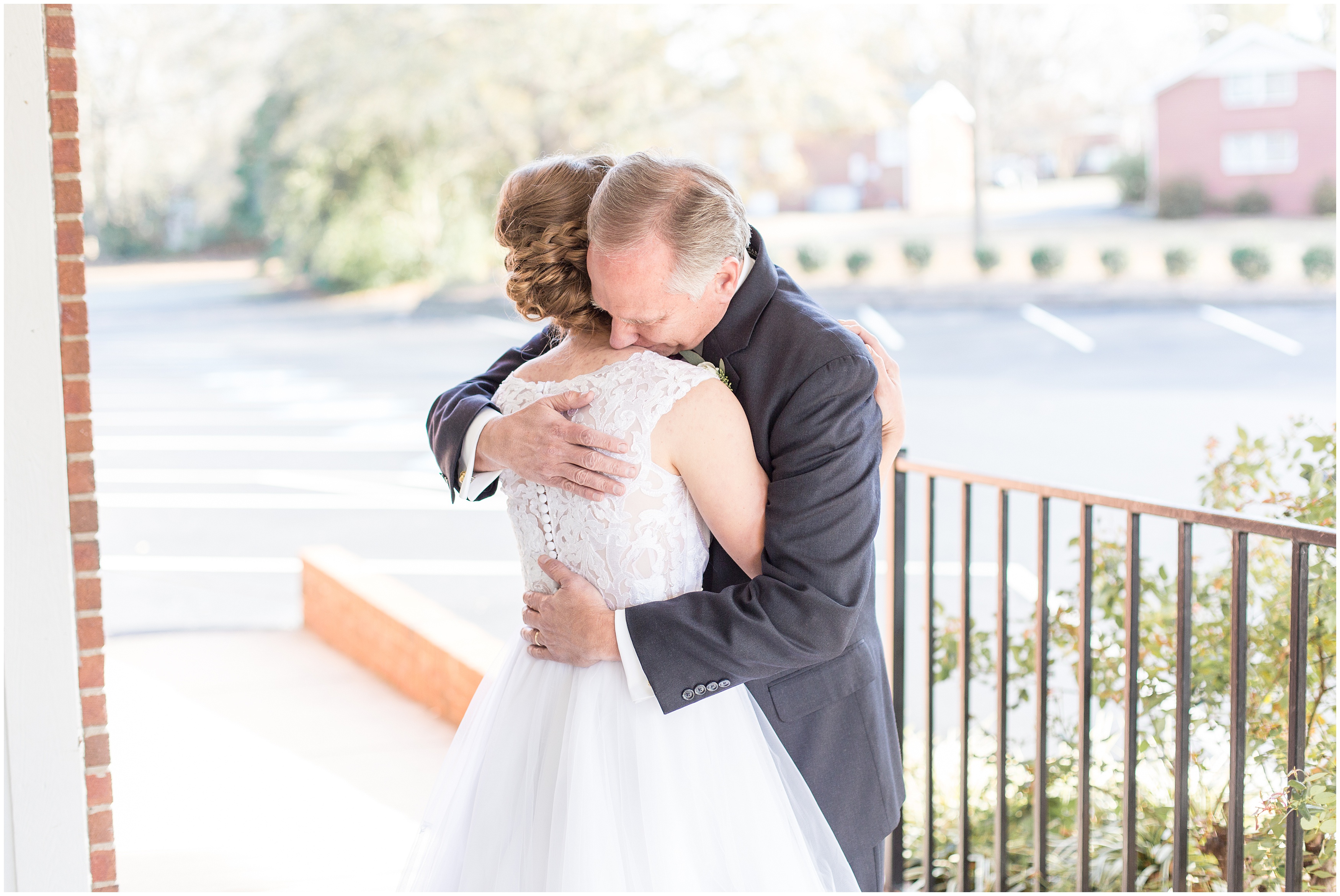 bride hugs father before wedding ceremony in NC