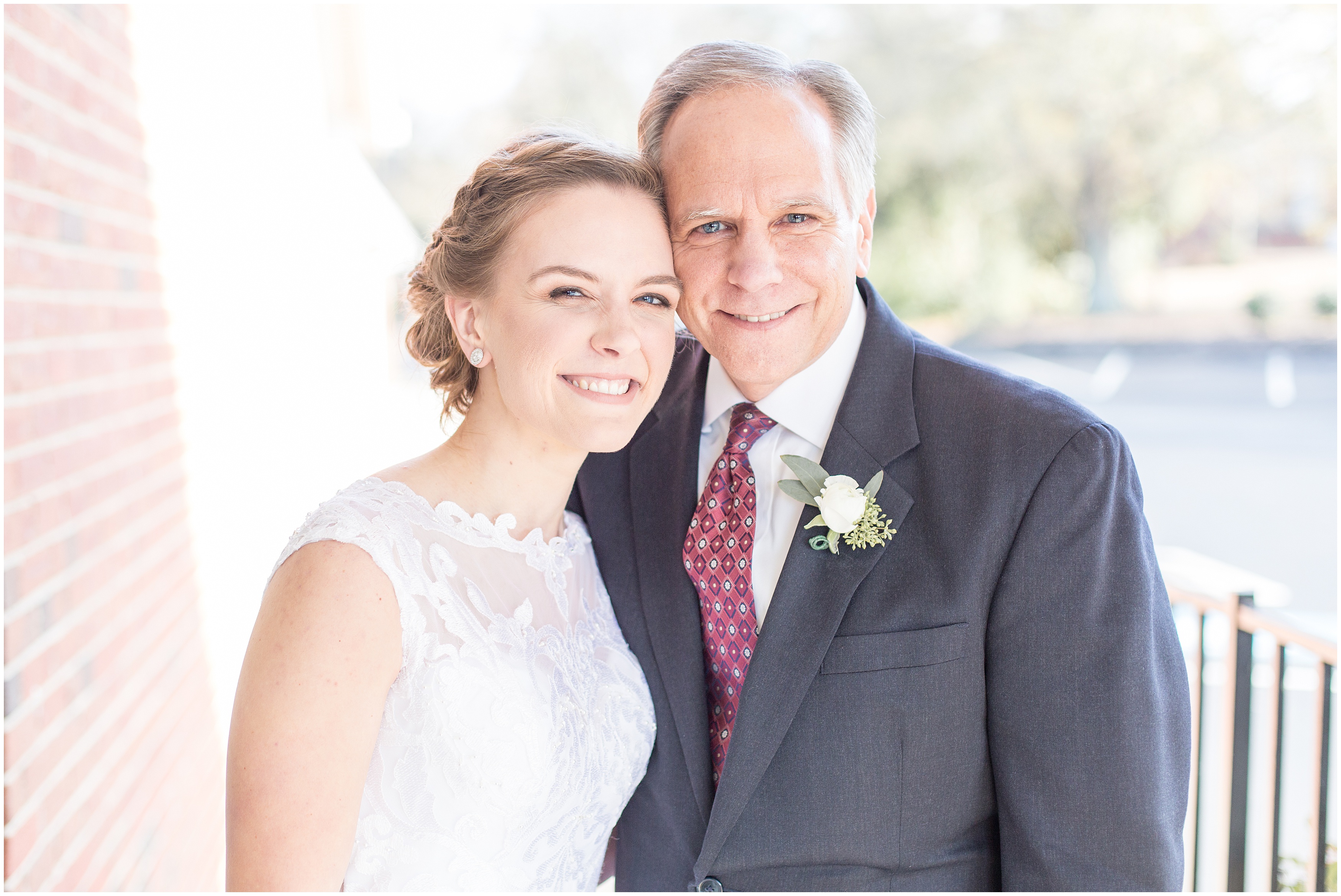 bride and her dad smile during wedding