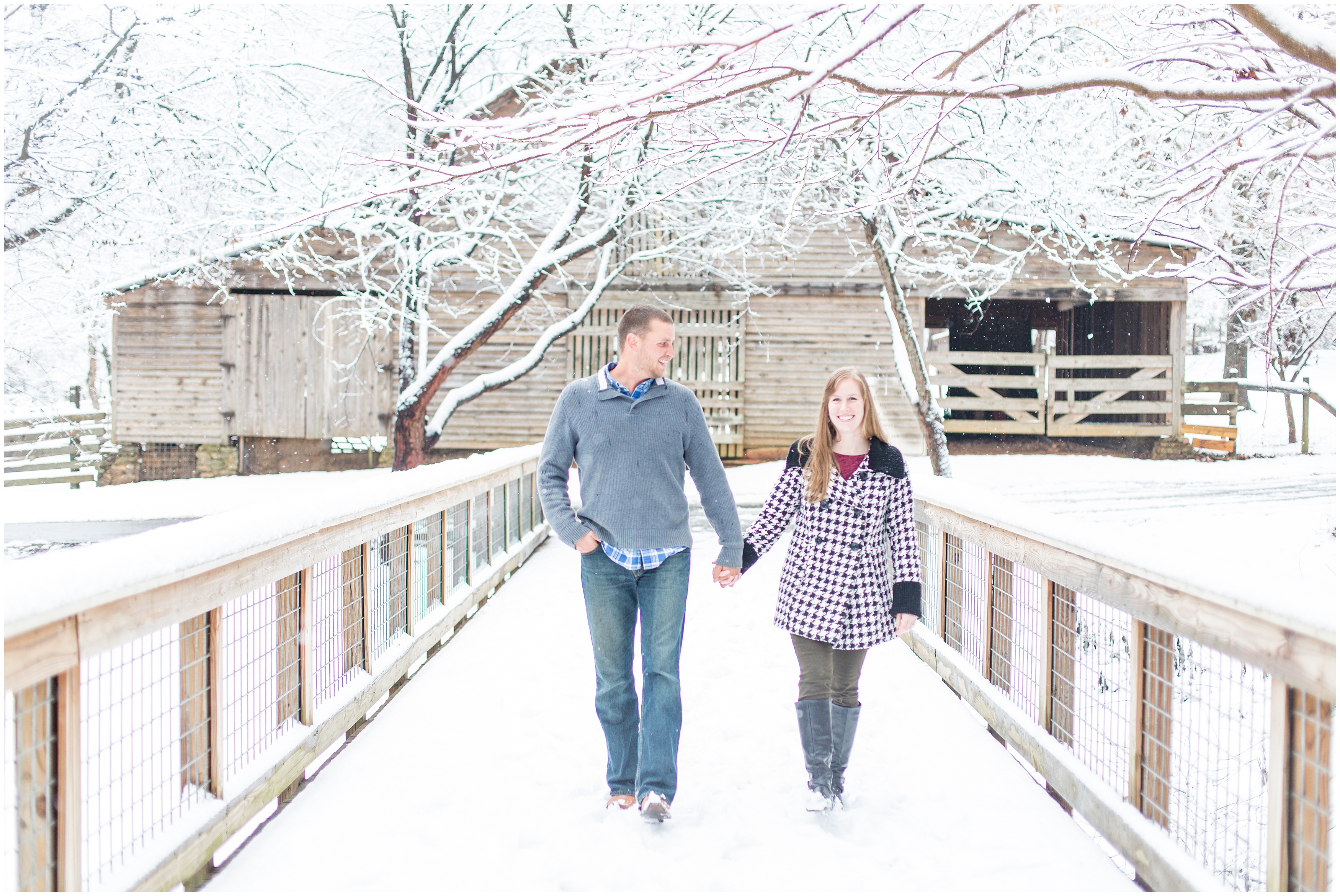 couple hold hands walking across a bridge in Atlanta GA during engagement session