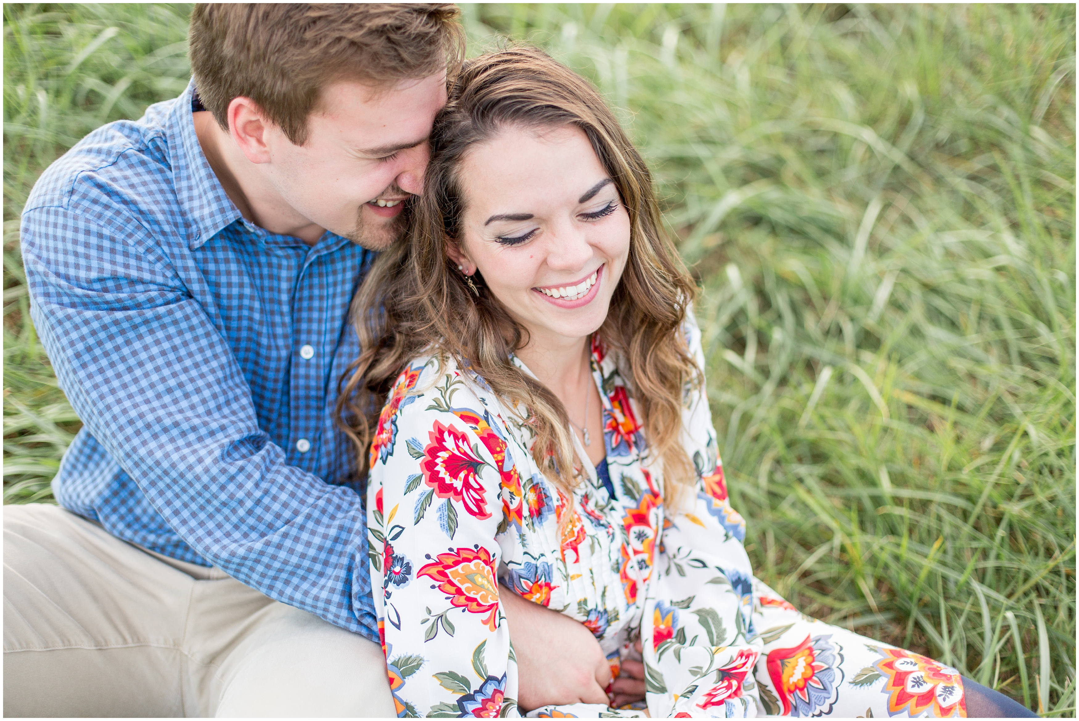 couple sit in grass during SC engagement photos