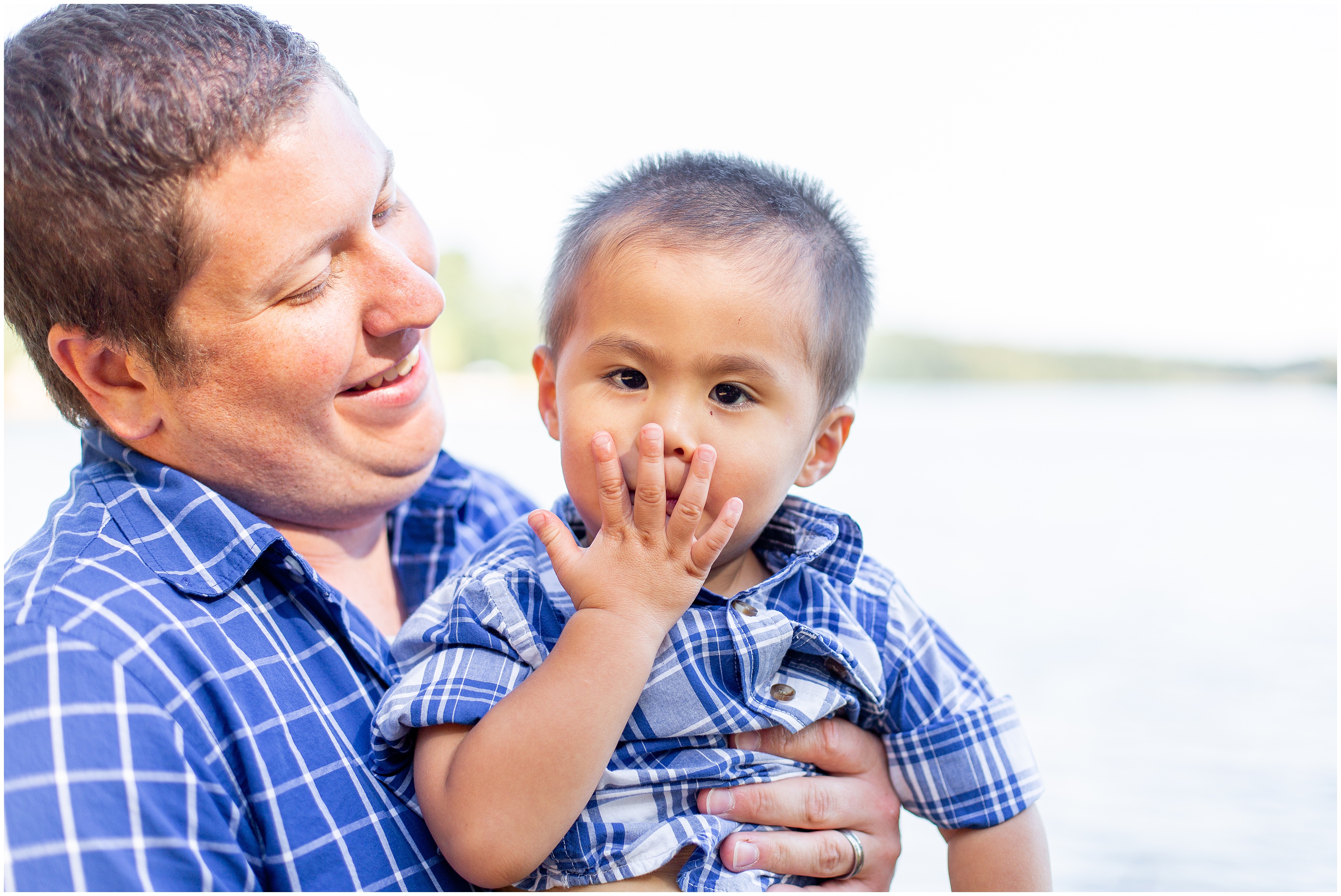 dad looks at son during Adoption Portraits