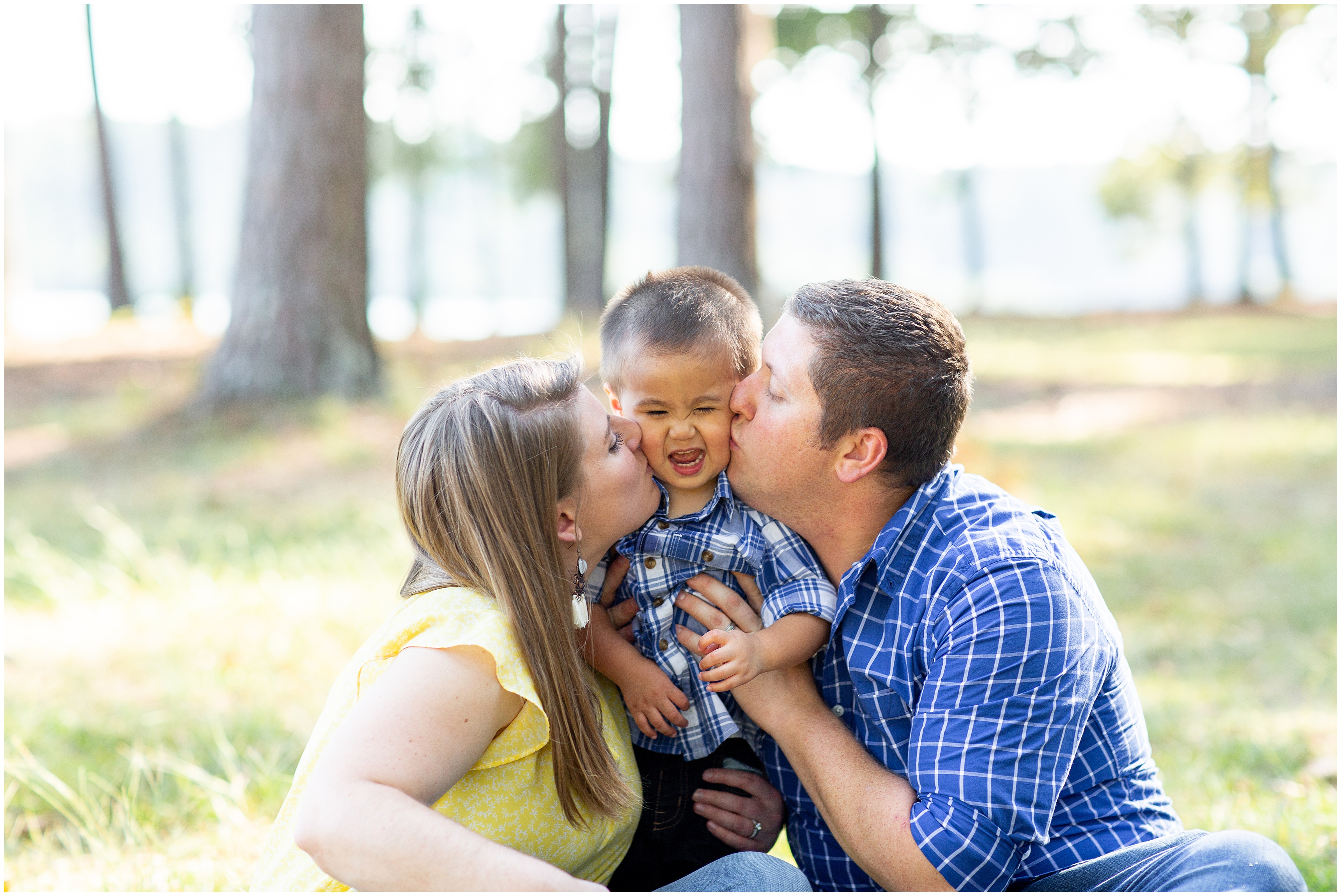 parents kiss baby during family photos