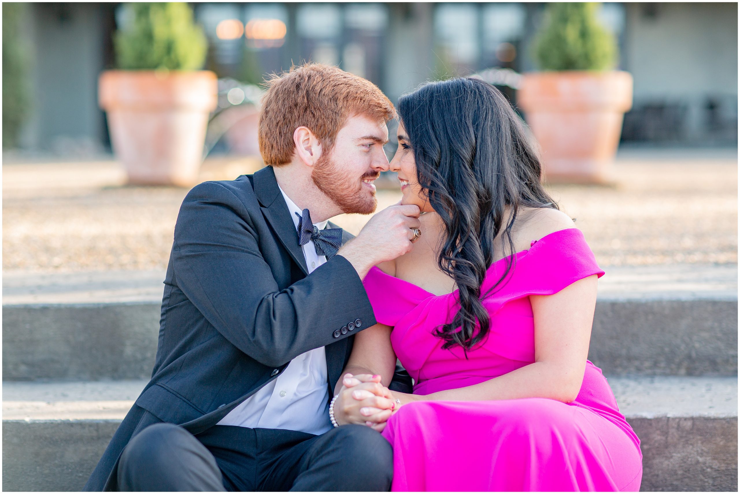 couple lean in for a kiss during engagement session in SC