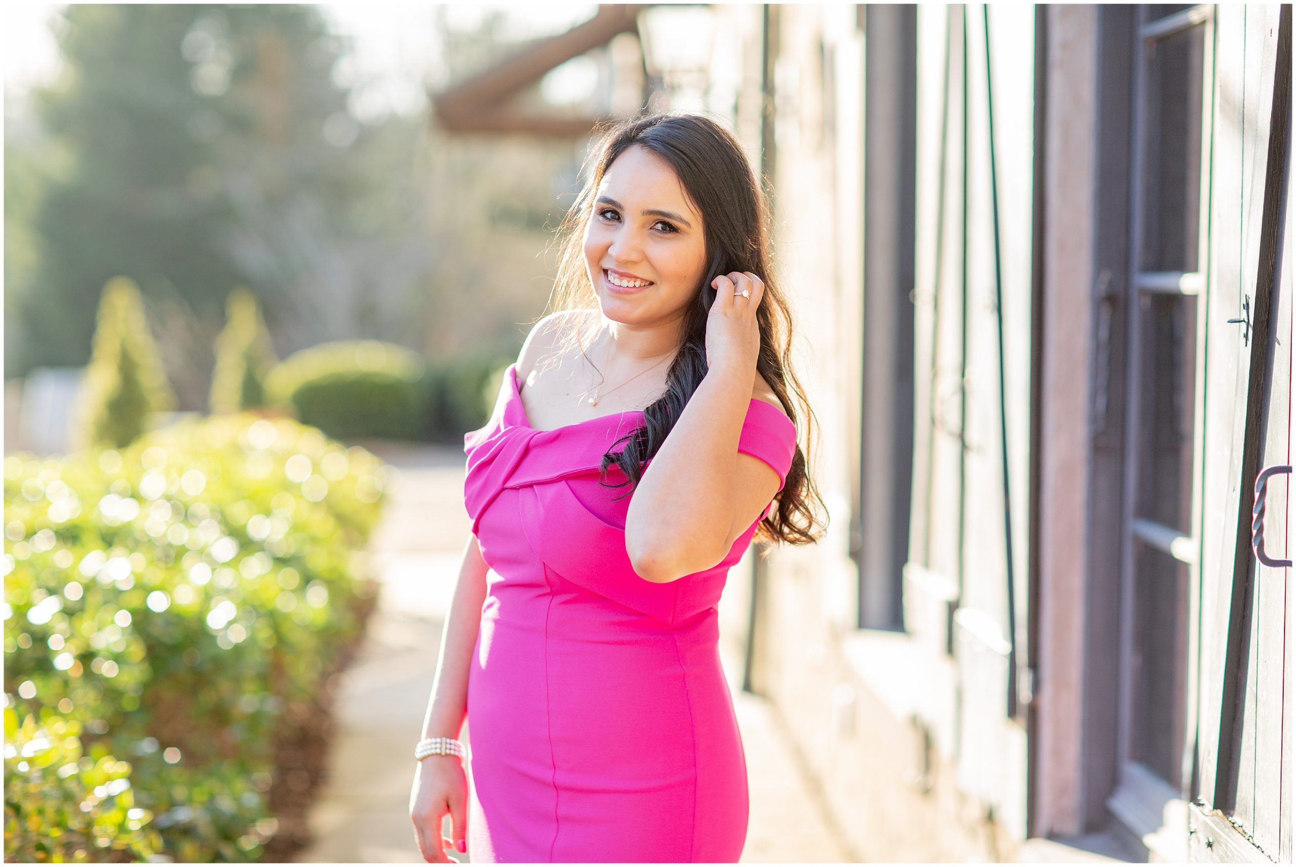 woman in hot pink dress for engagement photos