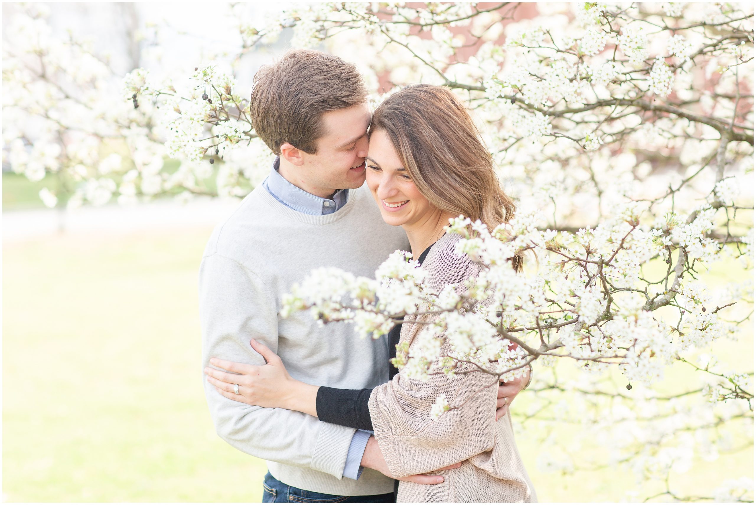 married couple hugs in tree during Lawrenceville Anniversary Session