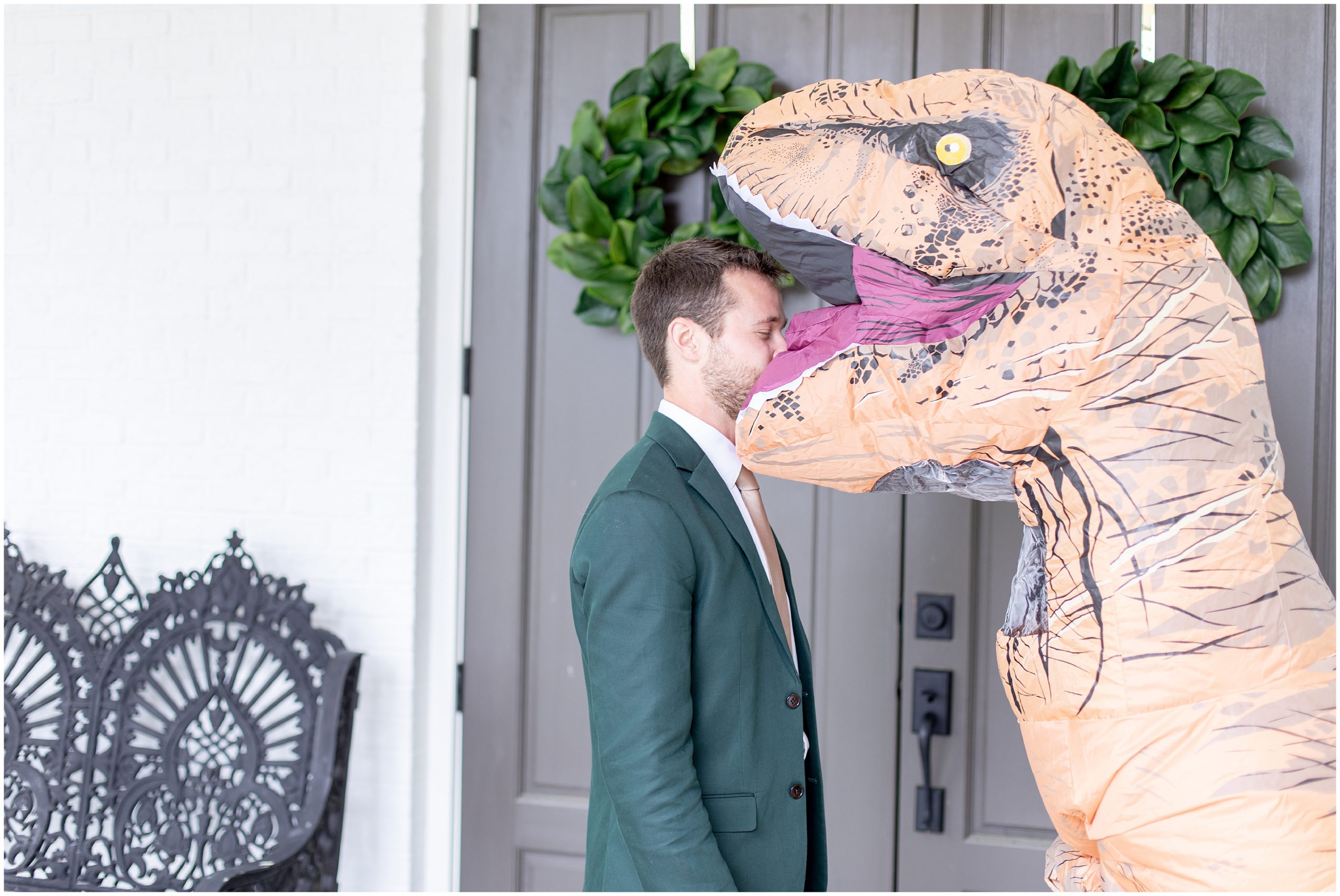 groom has first look with t-rex