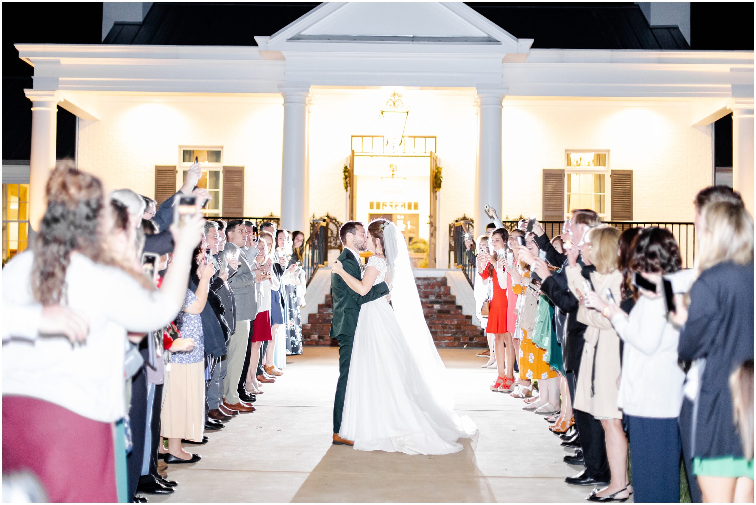 couple kisses during exit from Southern Alabama Wedding at The Witt House
