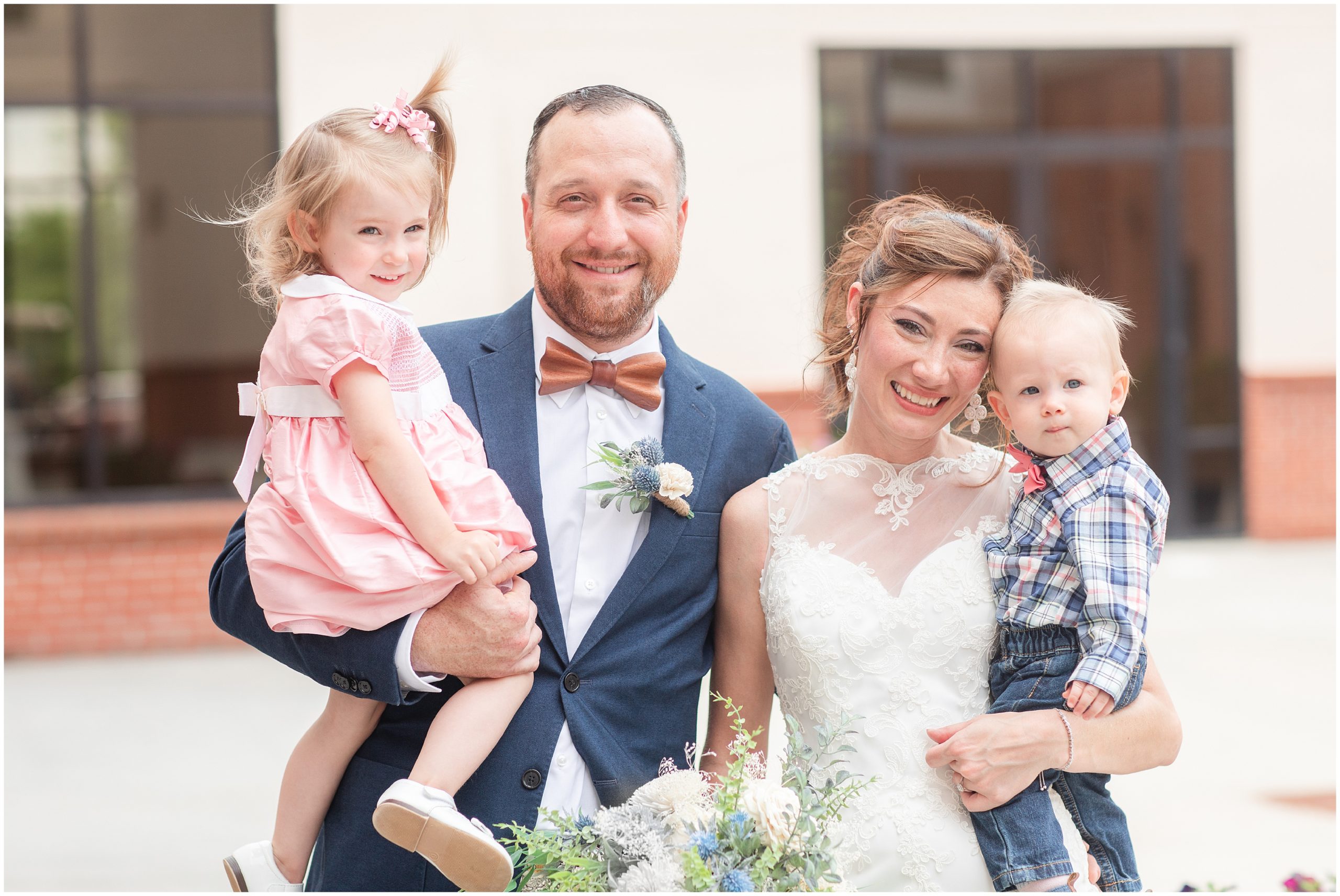 newlyweds pose with children during Lawrenceville wedding