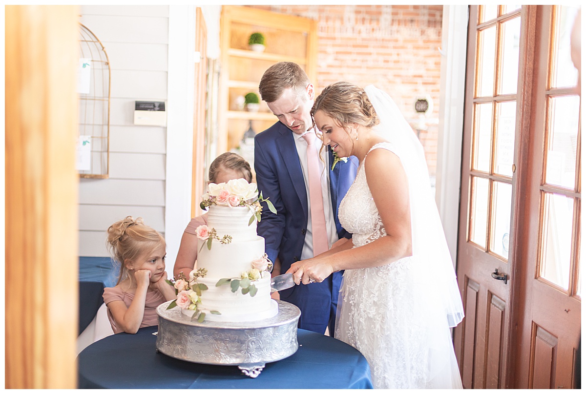 bride and groom cut wedding cake at Acworth GA wedding reception