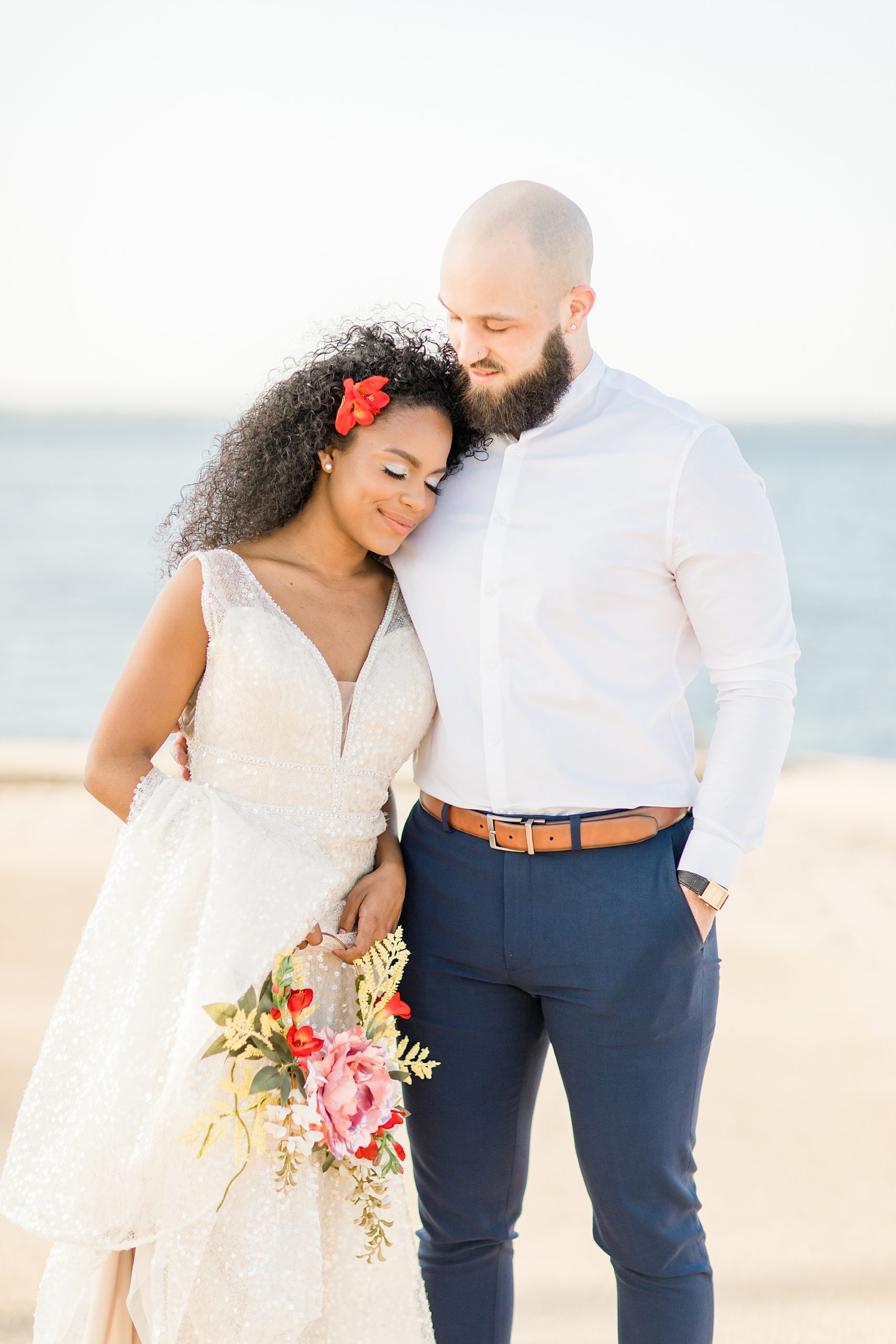 bride leans against groom during wedding photos in Orlando FL