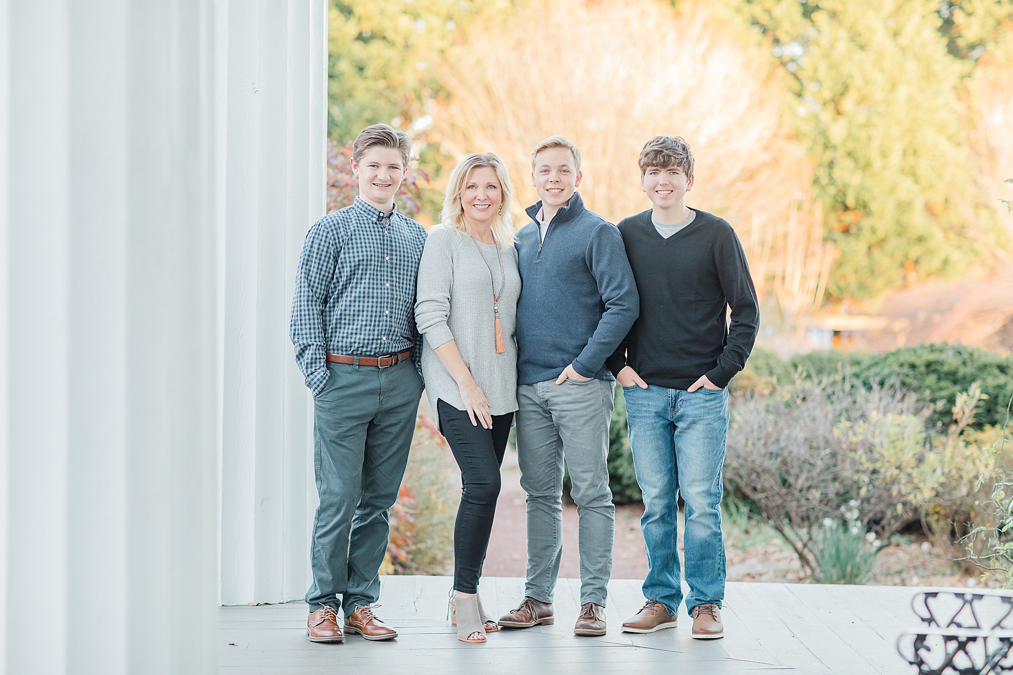 mom poses with sons during Charlotte family portraits 