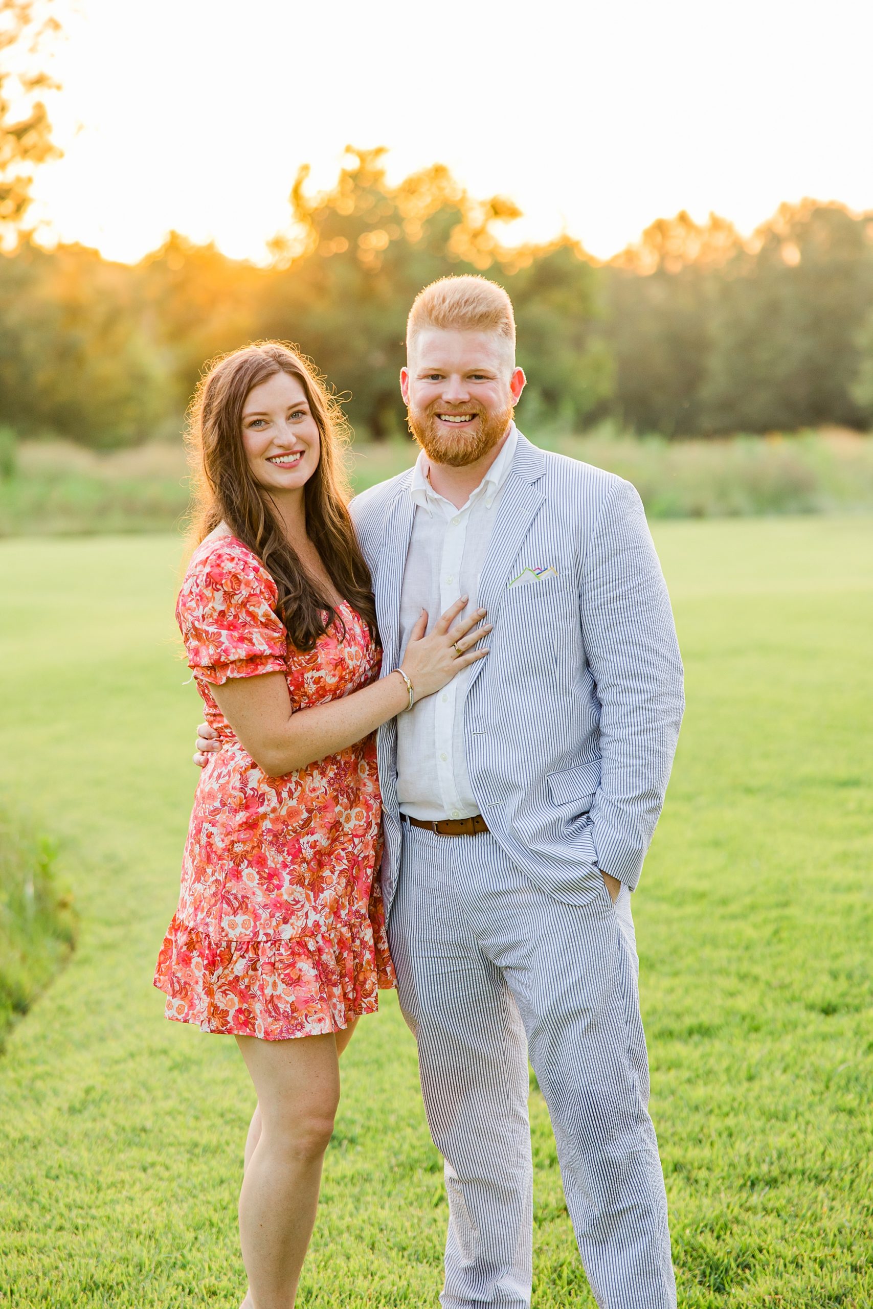 engaged couple hugs during proposal portraits 