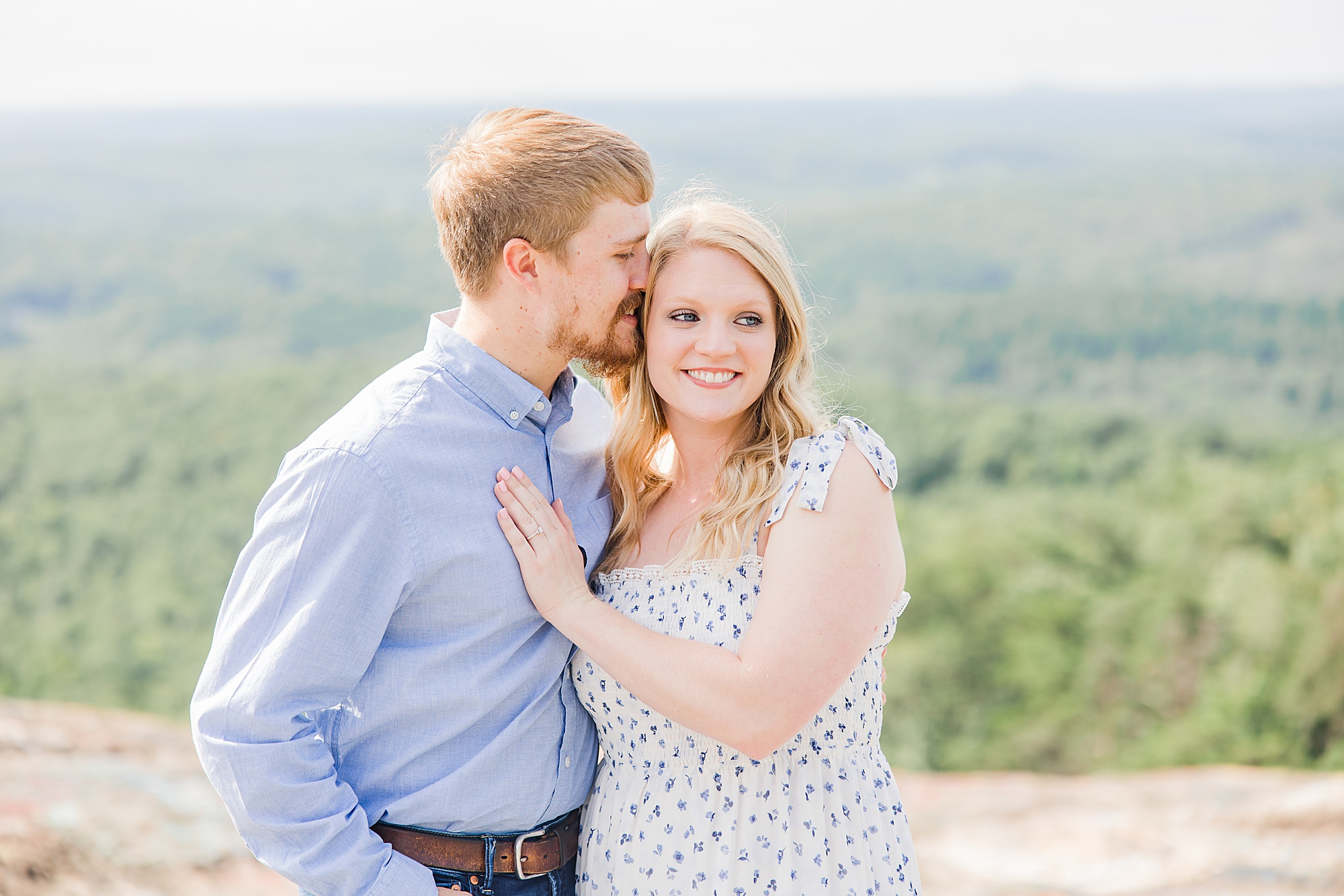 couple poses on Bald Rock during engagement photos