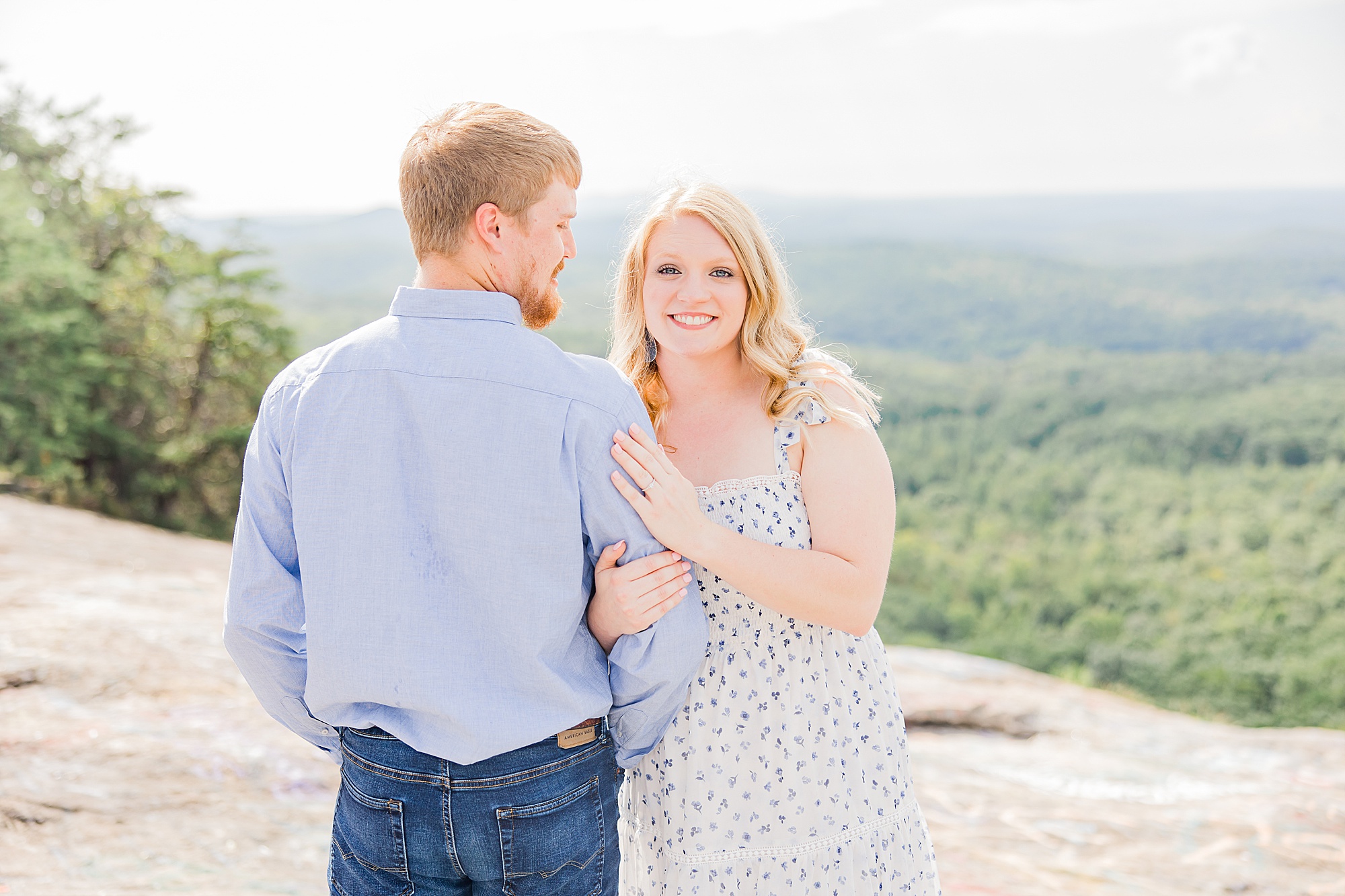 bride and groom stand on mountaintop in Greenville SC