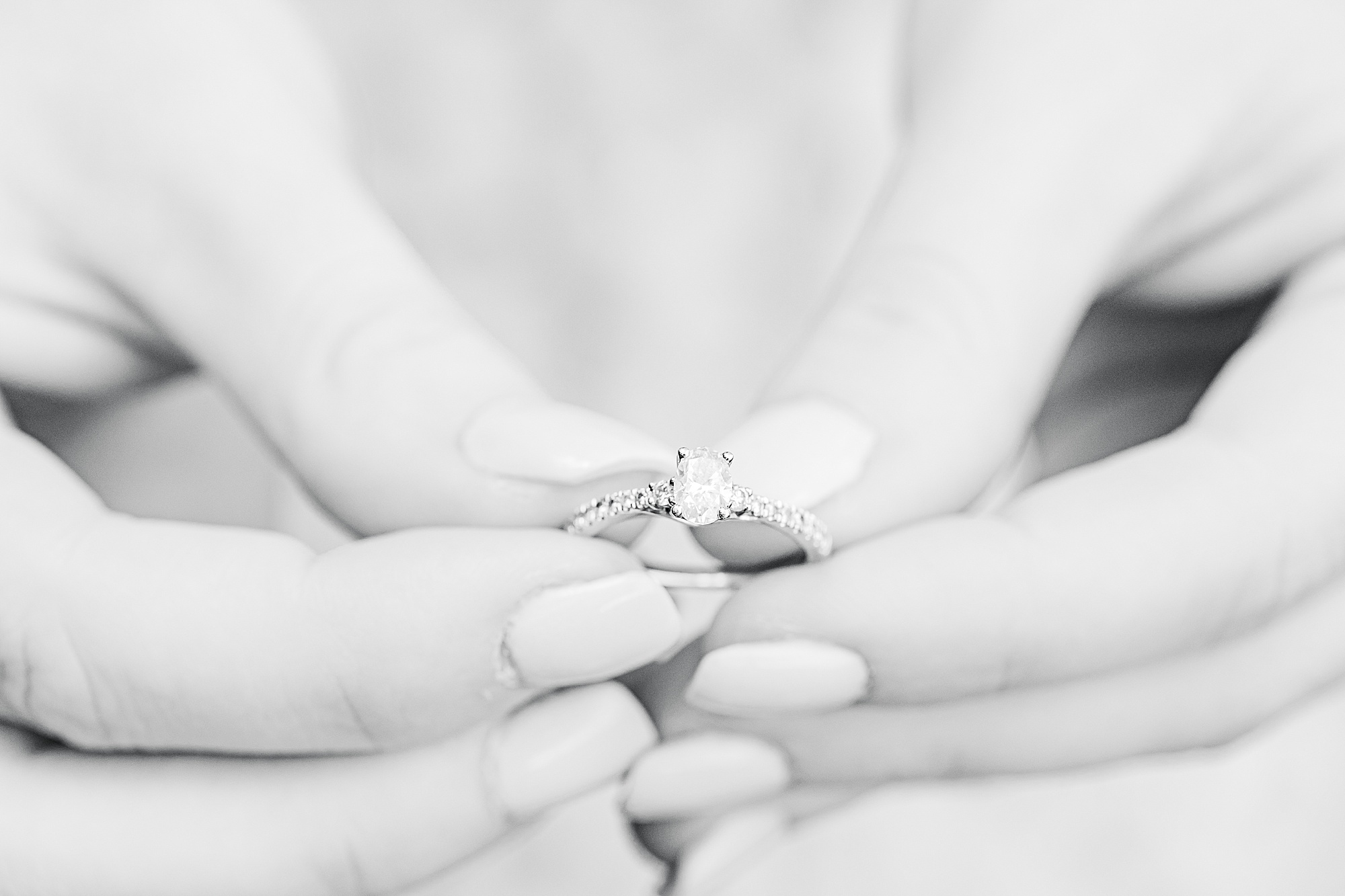 bride holds engagement ring during SC engagement photos